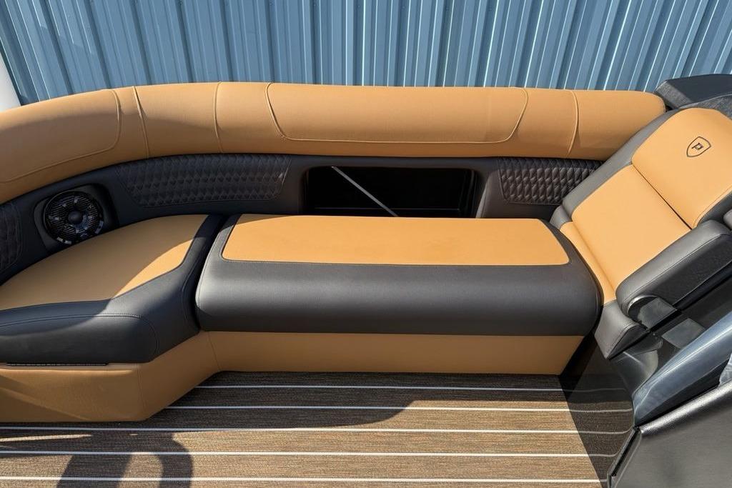 Luxurious seating in 2026 Premier 250 Solaris RS CL boat, featuring tan and black upholstery.
