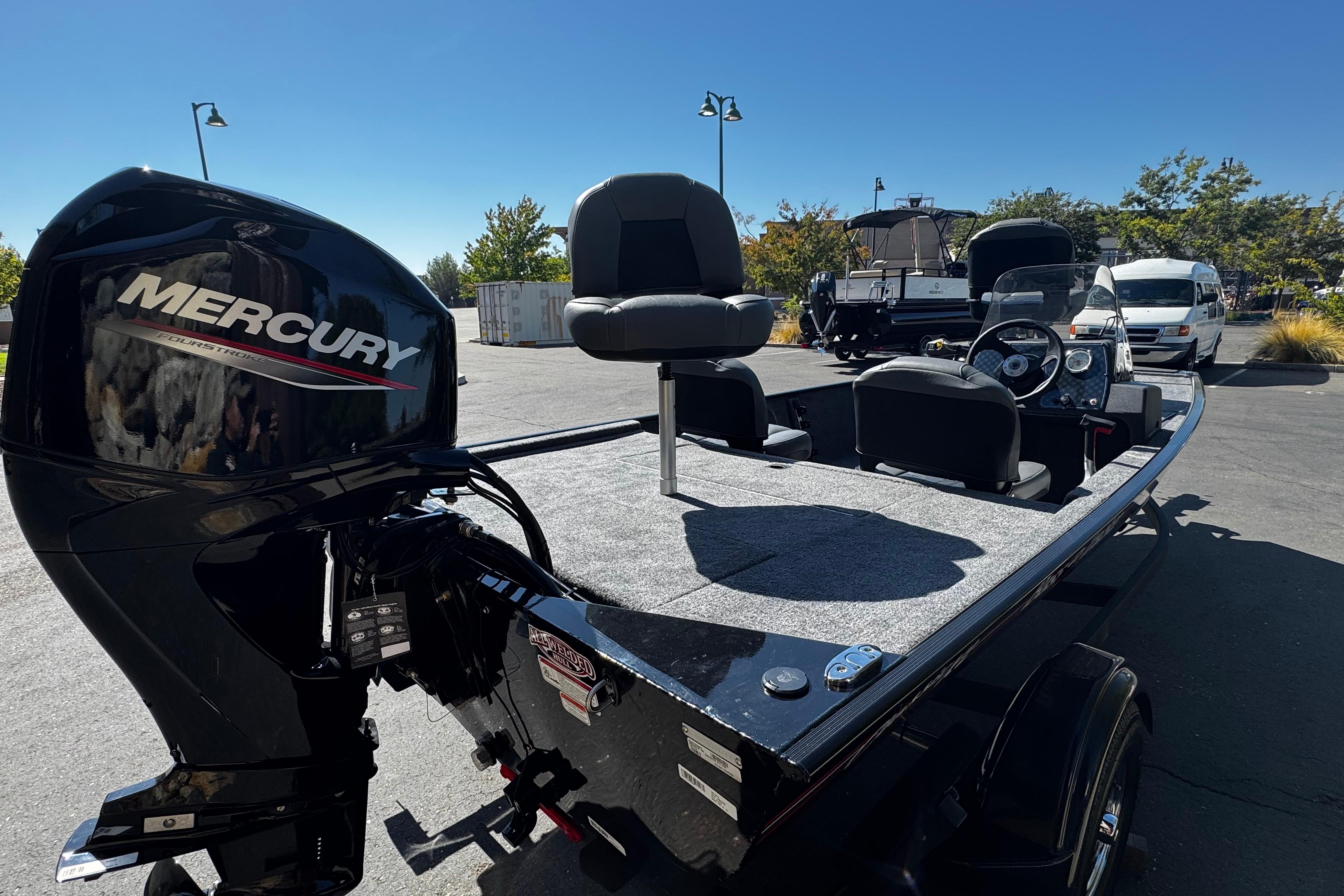 2026 Tracker Bass Tracker Classic XL boat with Mercury engine in outdoor setting.