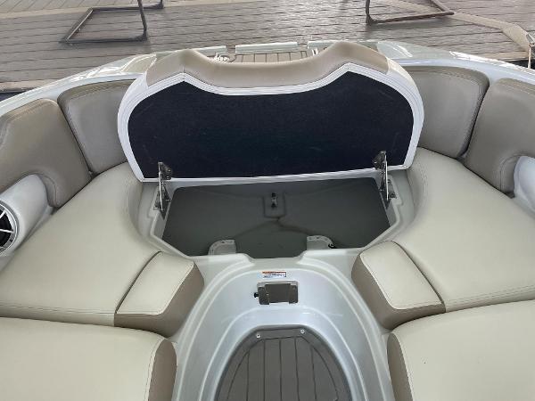 2019 Crownline E255 boat interior with open storage compartment.