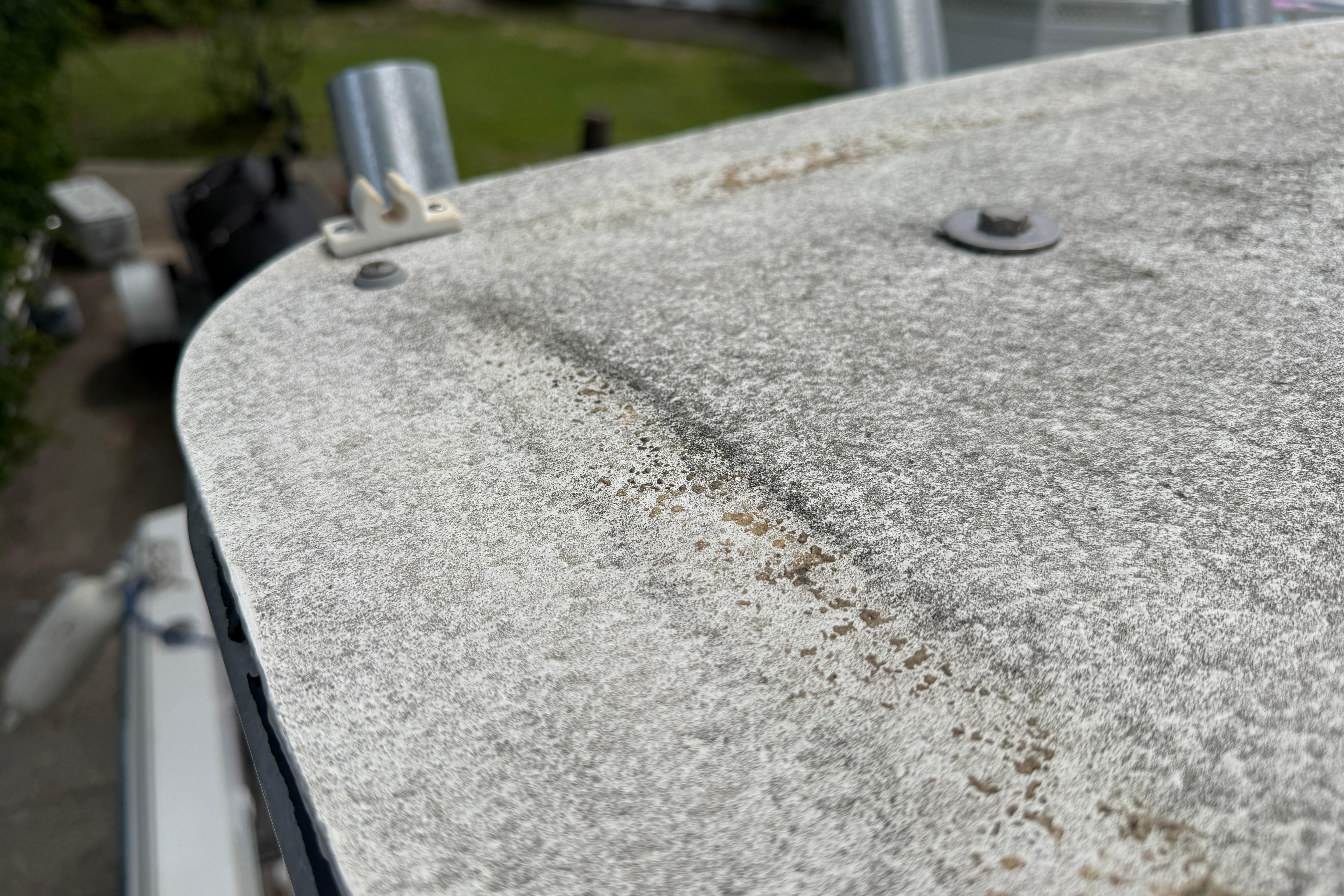 Close-up of weathered surface on 1987 Grady-White Seafarer 226 boat.
