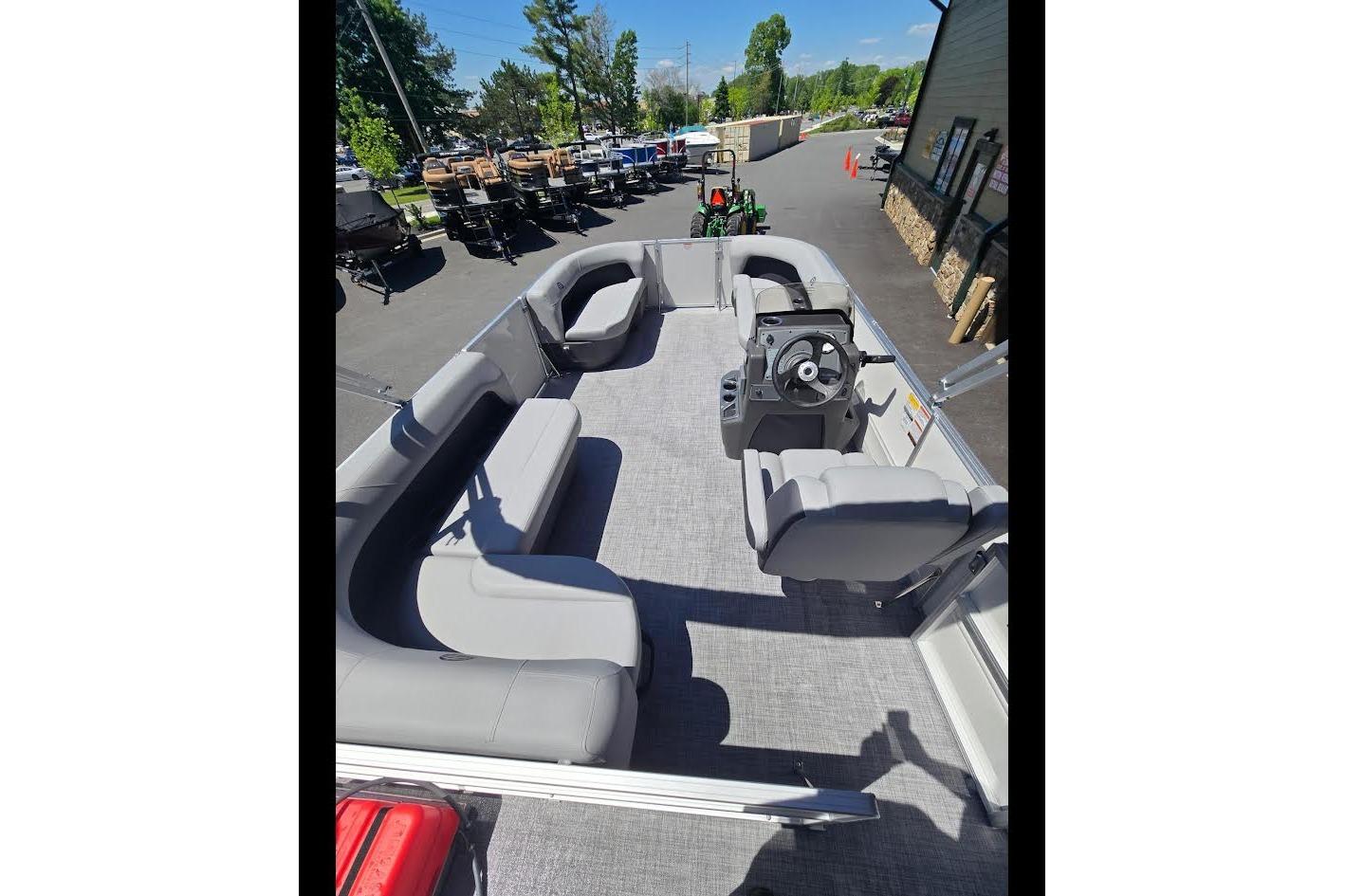 2026 Sun Tracker Party Barge 16 DLX pontoon boat with spacious seating and modern design.