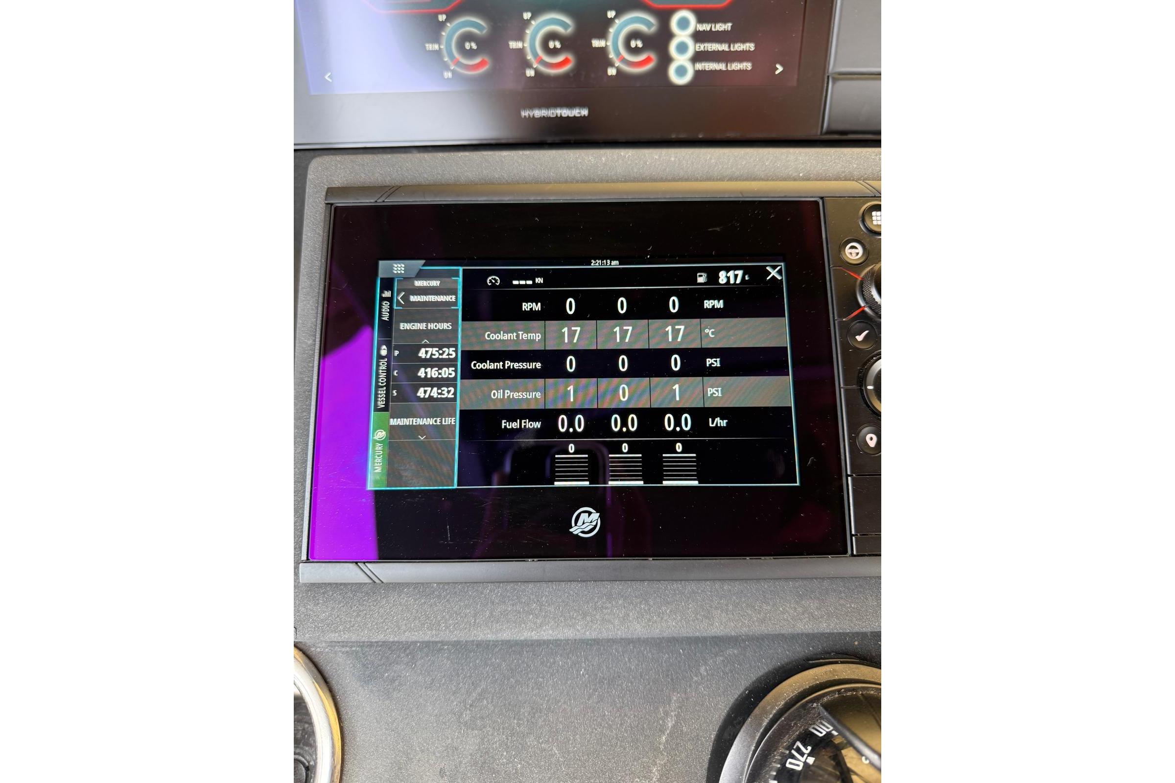 Dashboard display of a 2021 Technohull Omega 47 showing engine metrics and maintenance data.