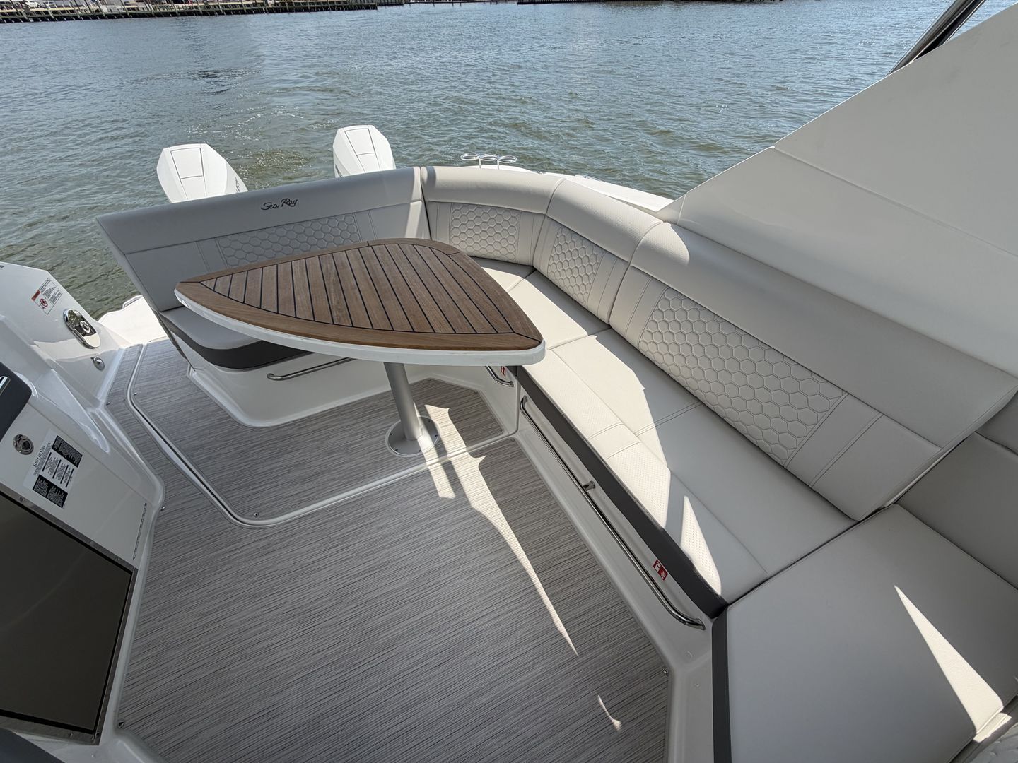 Interior of 2026 Sea Ray Sundancer 320 Outboard with elegant seating.