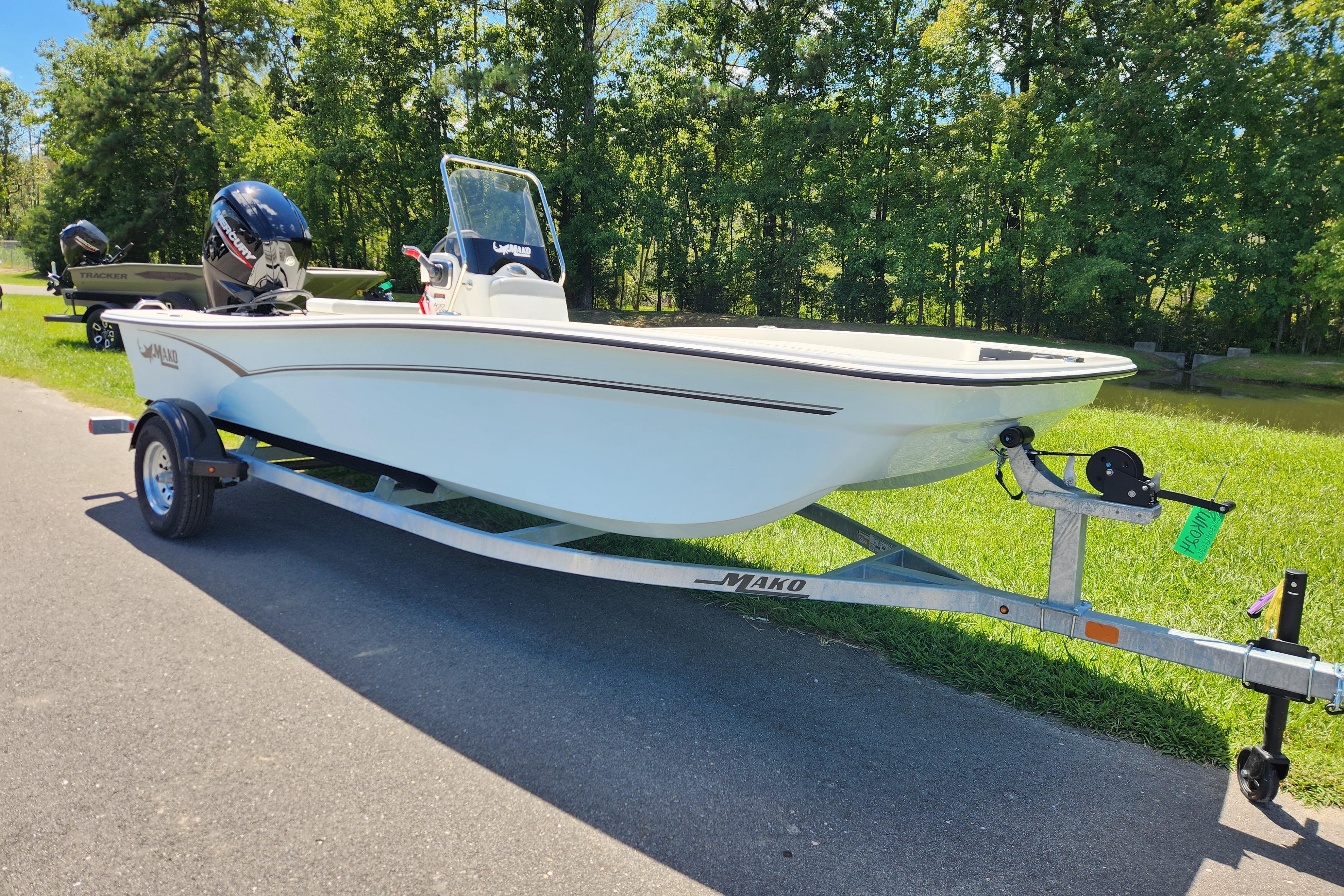 2026 Mako Pro Skiff 17 CC boat on trailer, parked on a sunny day.