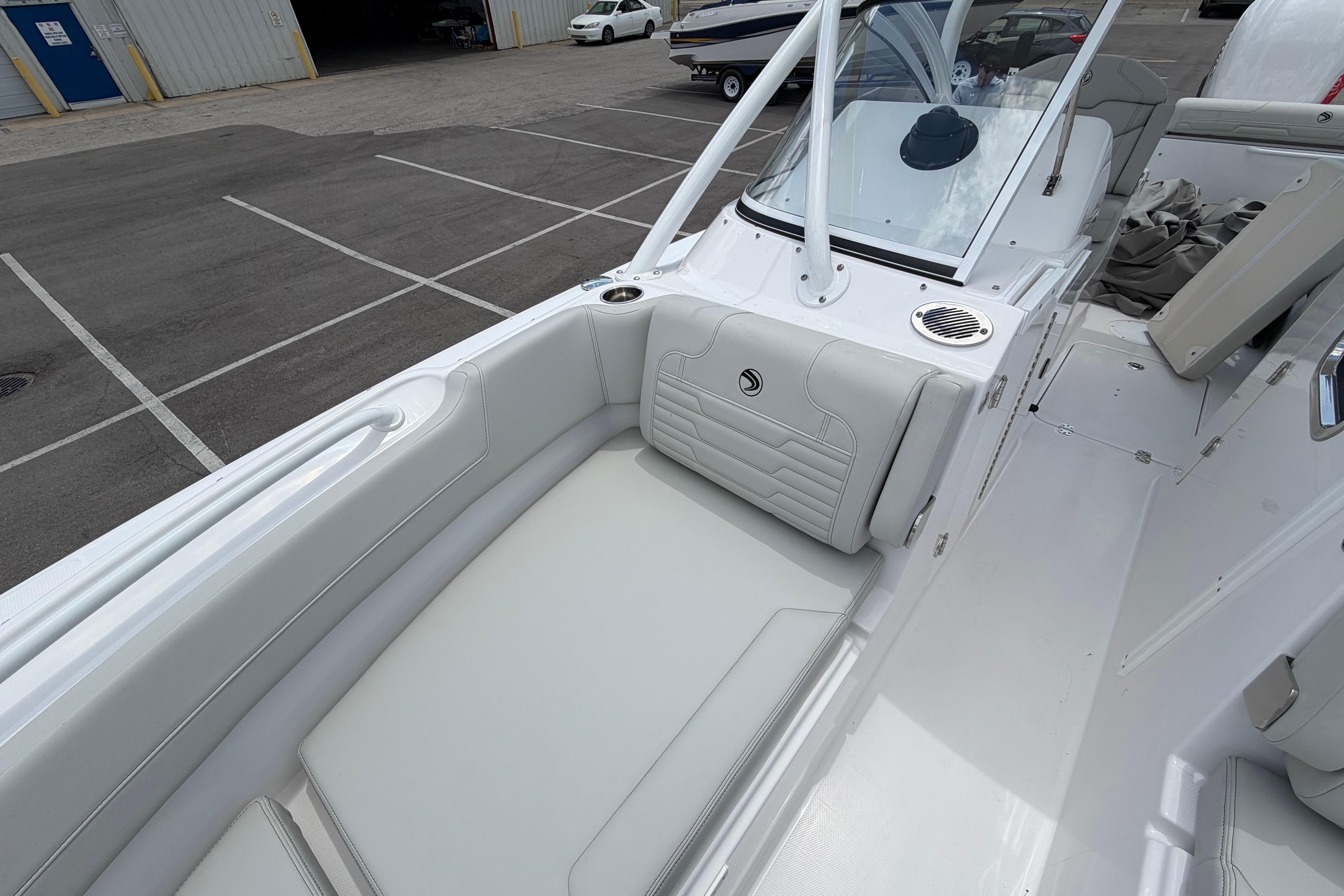 2026 Edgewater 248CX Crossover boat interior with white seating and sleek design.