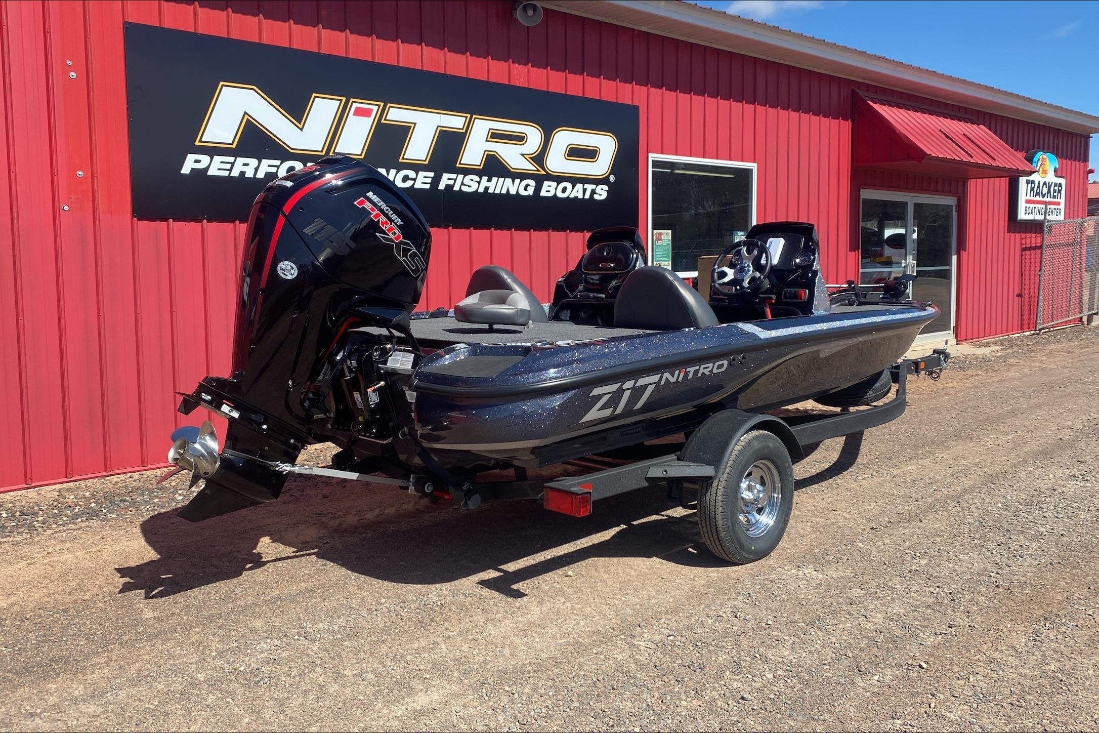 2026 Nitro Z17 fishing boat displayed outside a red building with a Mercury Pro XS engine.