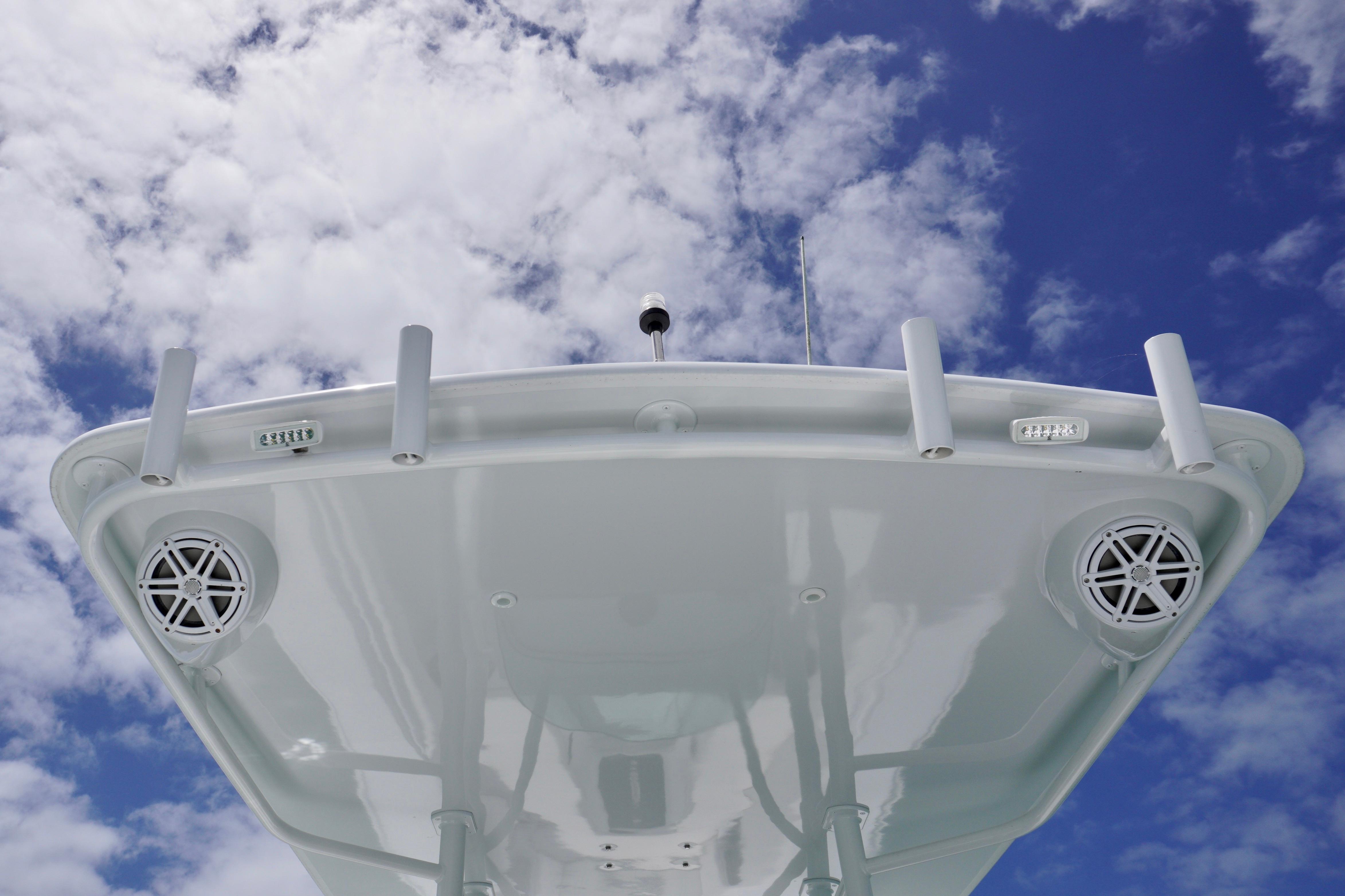 2013 Contender 35 LS boat top view against a cloudy sky.