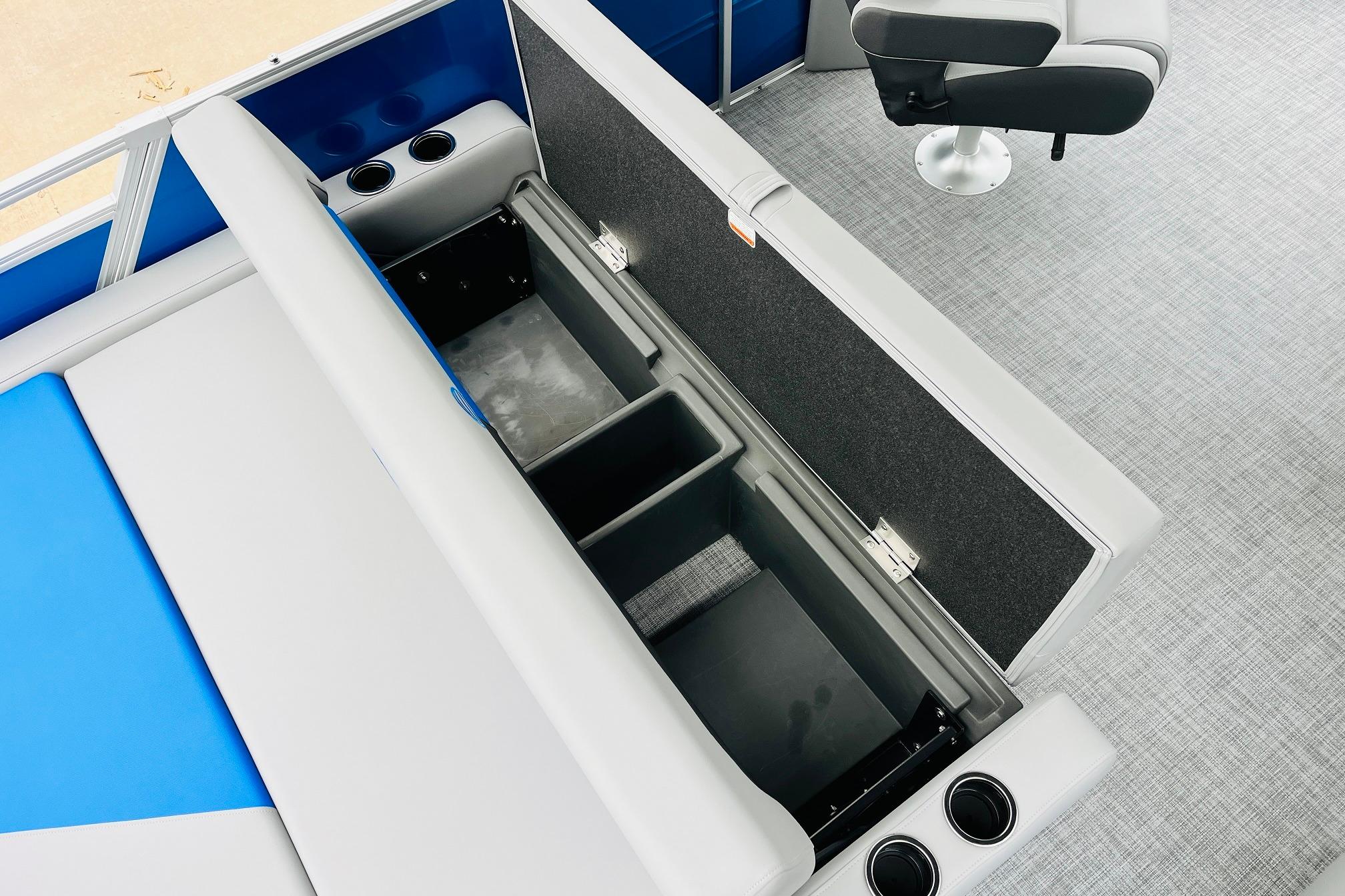 2026 Sun Tracker Party Barge 22 RF DLX interior storage and seating with cup holders.