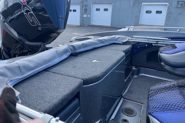 2026 Ranger 1880MS boat interior with motor, storage, and seating.