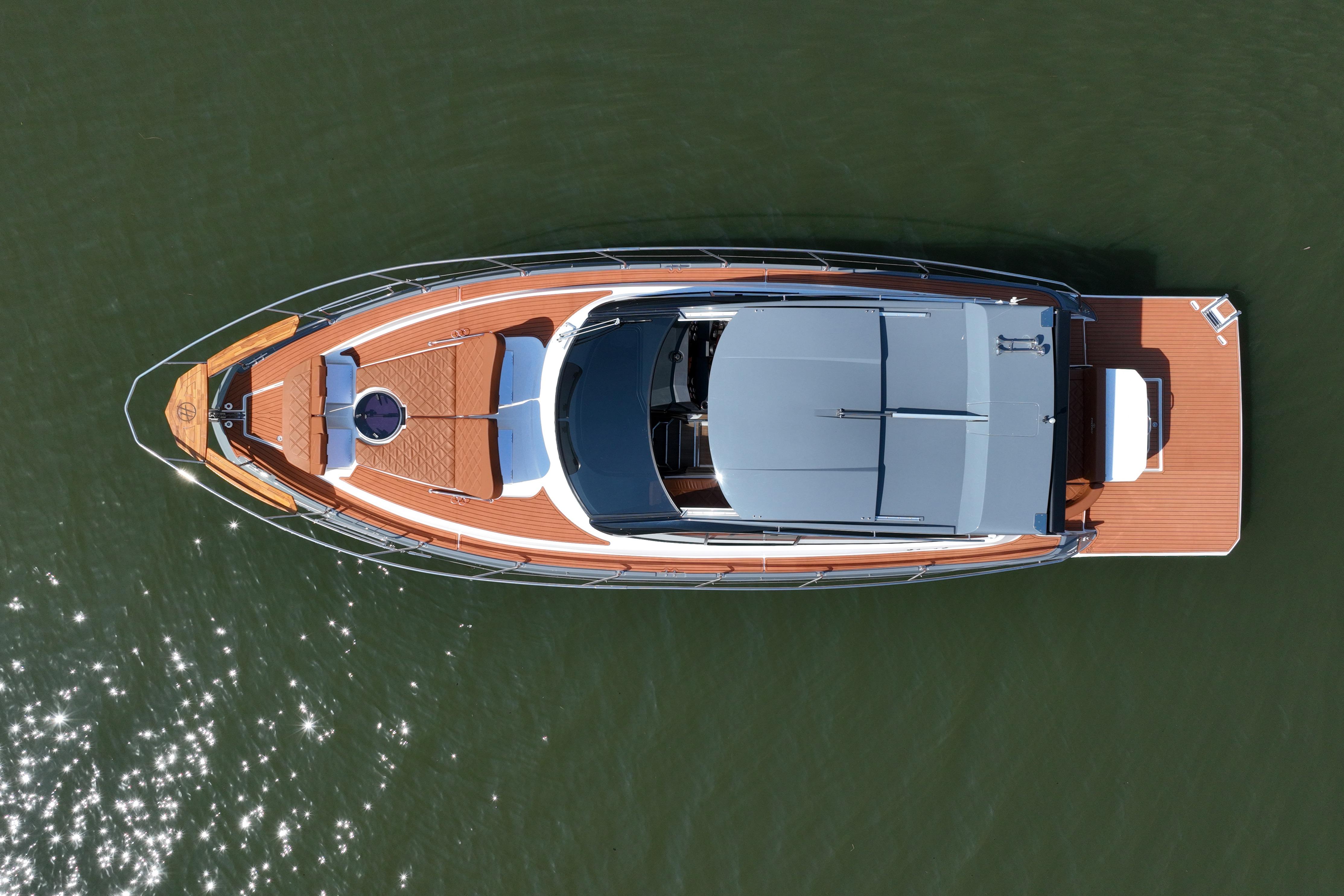 Aerial view of 2026 Hanover 415 luxury yacht on calm water.