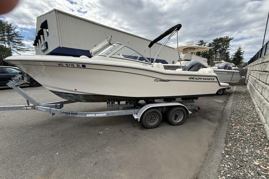 2019 Grady-White Freedom 215 boat on trailer, parked outdoors.
