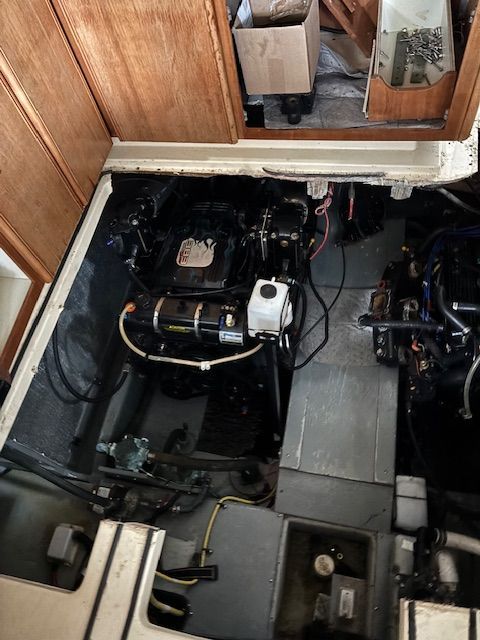 Engine room of a 2004 Meridian 341 Sedan with two engines and wiring.