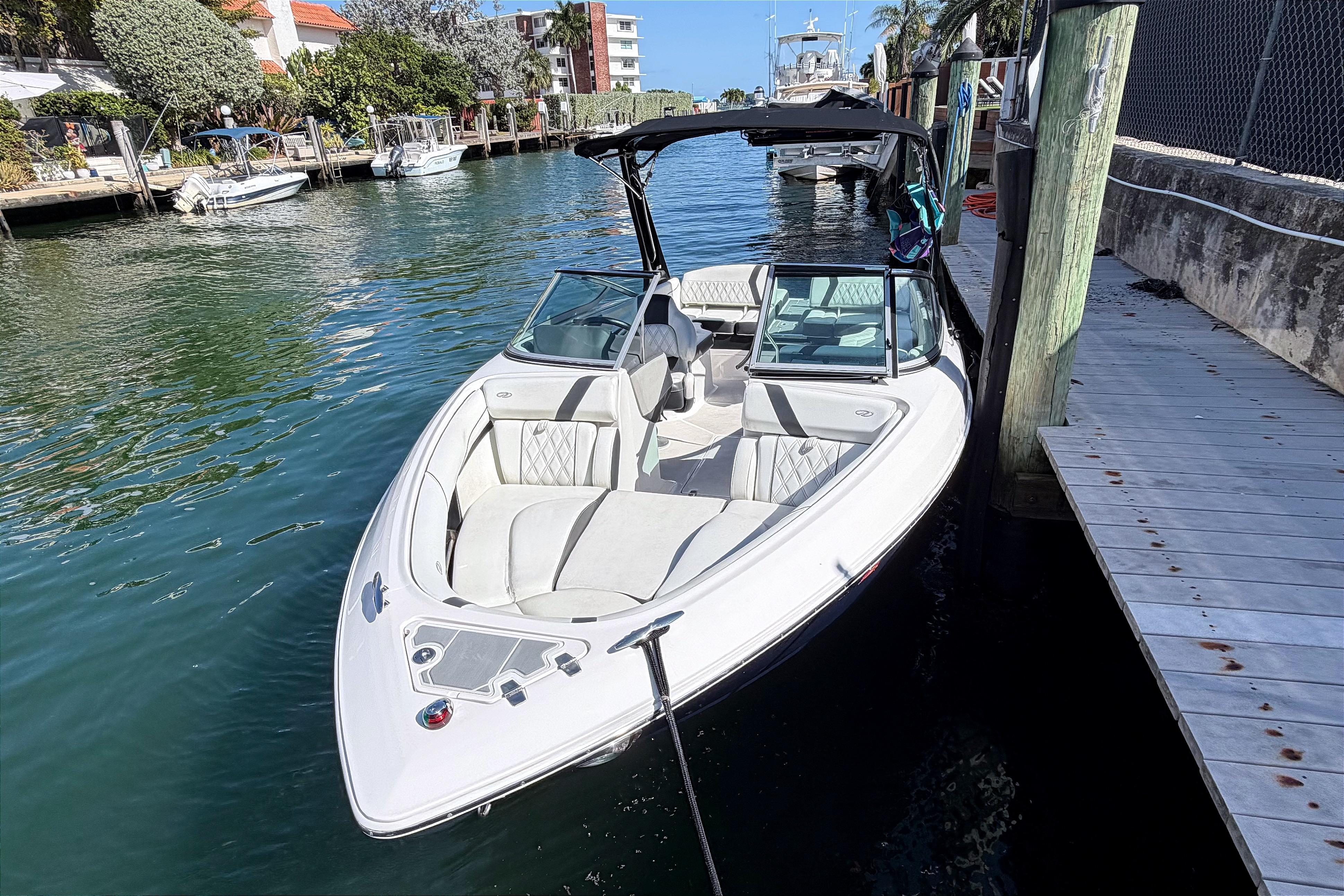 2020 Regal 2300 Bowrider boat docked in a scenic waterfront location.