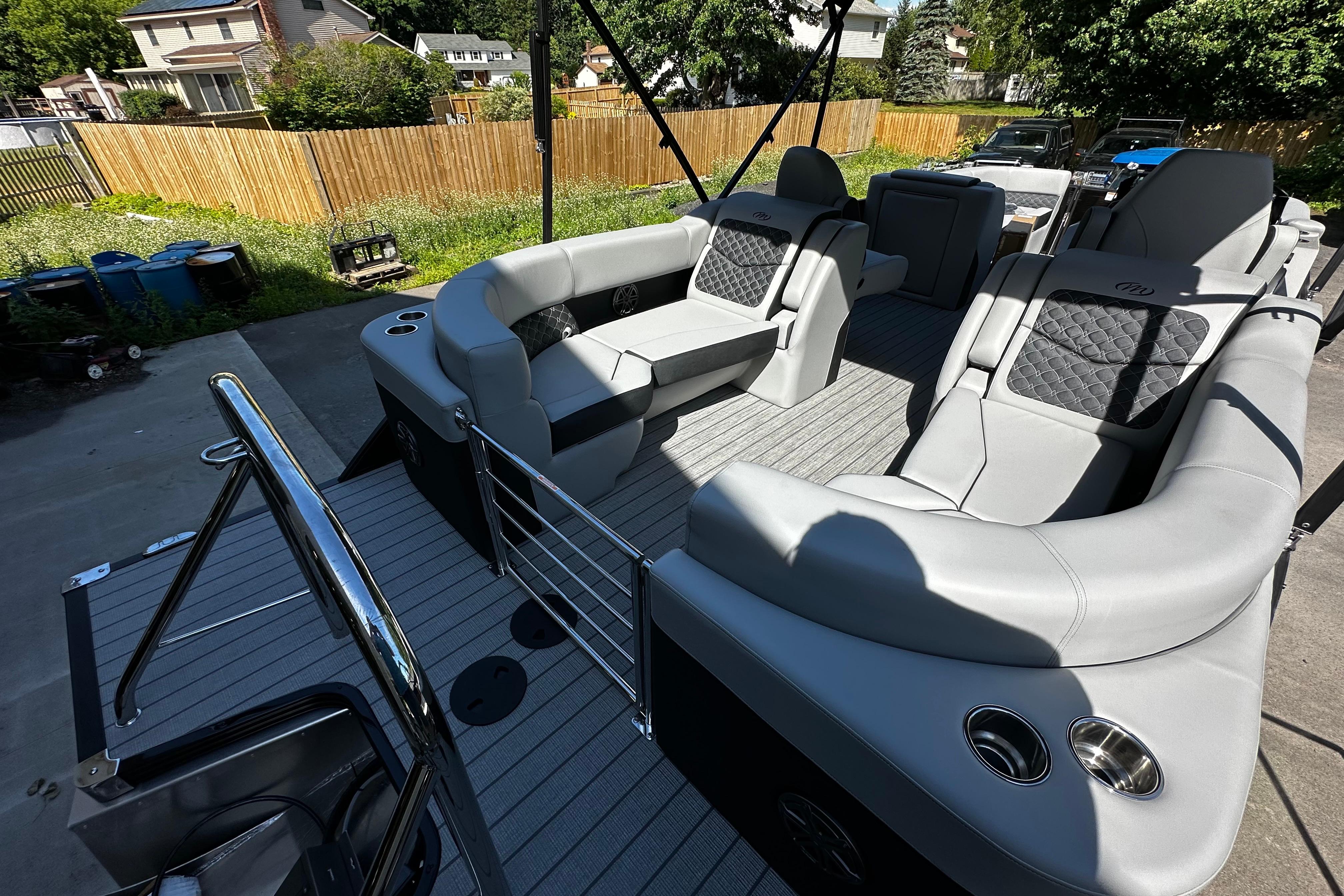 Luxurious interior of 2027 Manitou 25 Encore RF pontoon boat with plush seating.