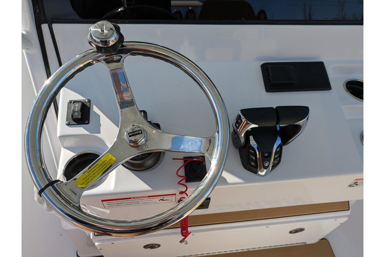 Steering wheel and controls of 2025 Sportsman Open 282 Center Console boat.