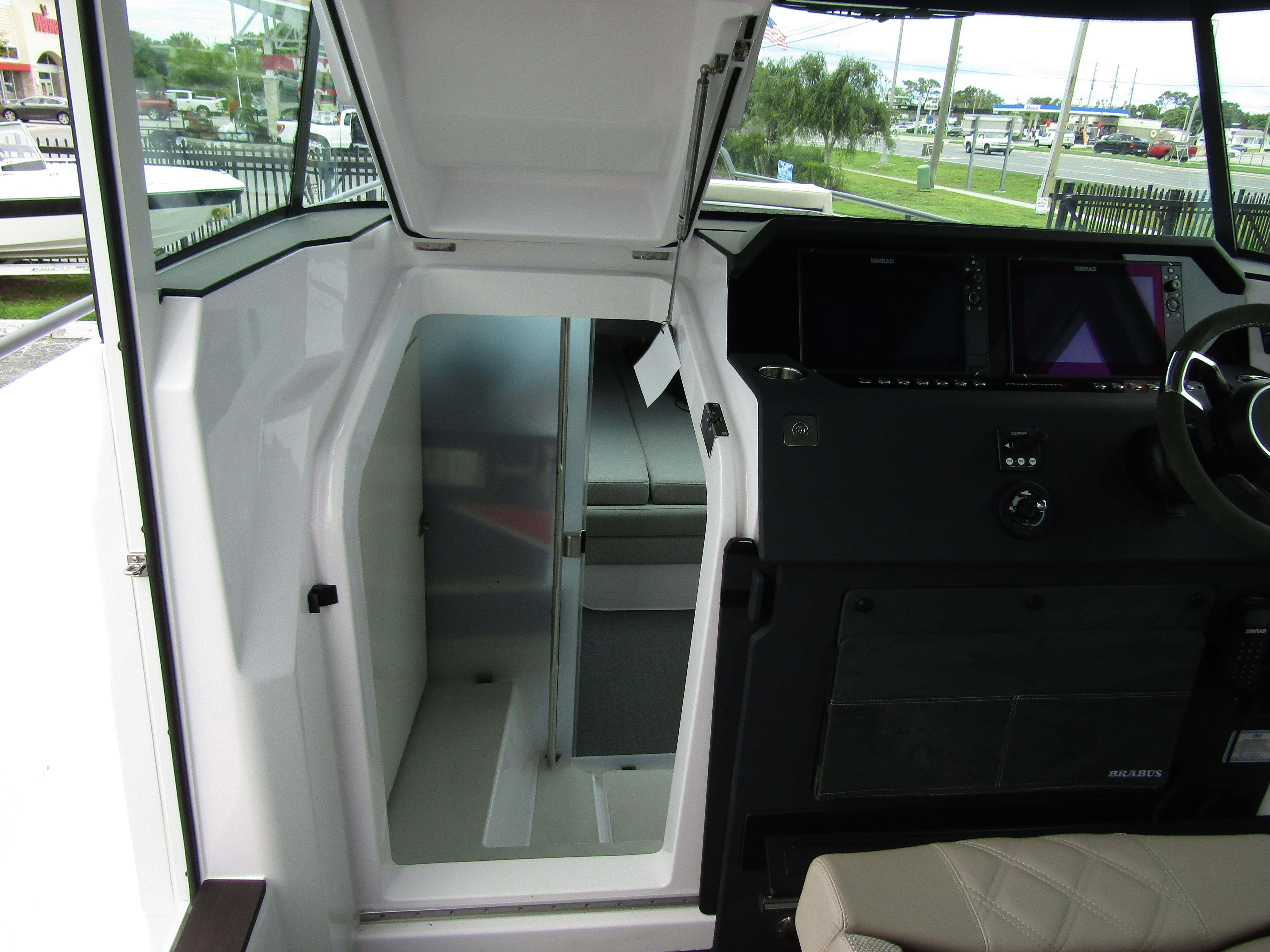 2024 Axopar 37XC CROSS CABIN interior with modern helm and cabin access.