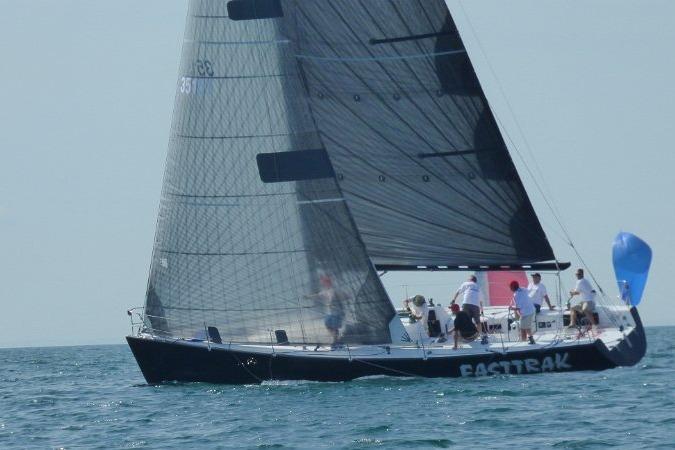 Sailing yacht Nelson Marek 43, 1993 model, with crew on open sea.