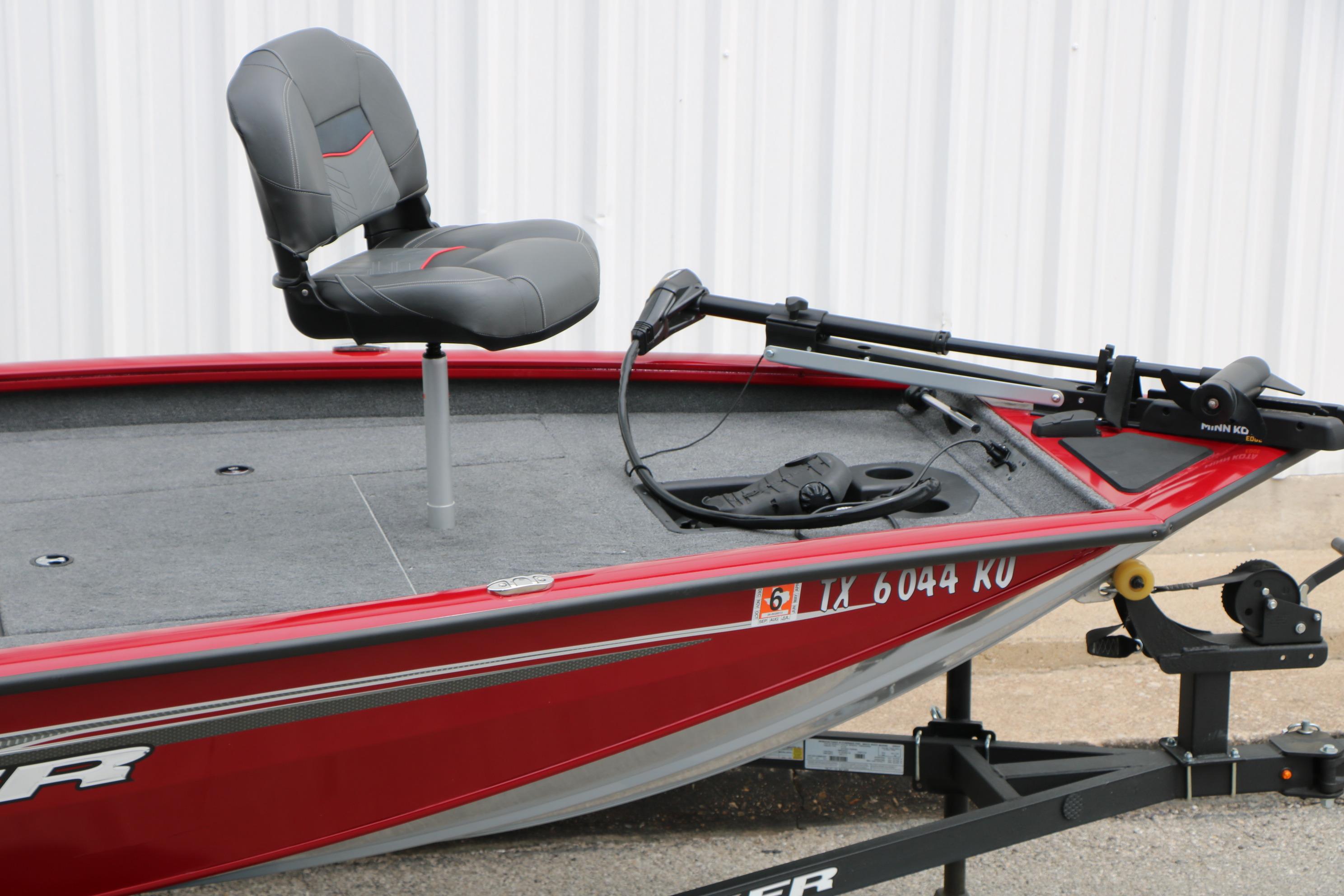 2024 Tracker Pro Team 175 boat, red exterior, with a mounted seat and trolling motor.
