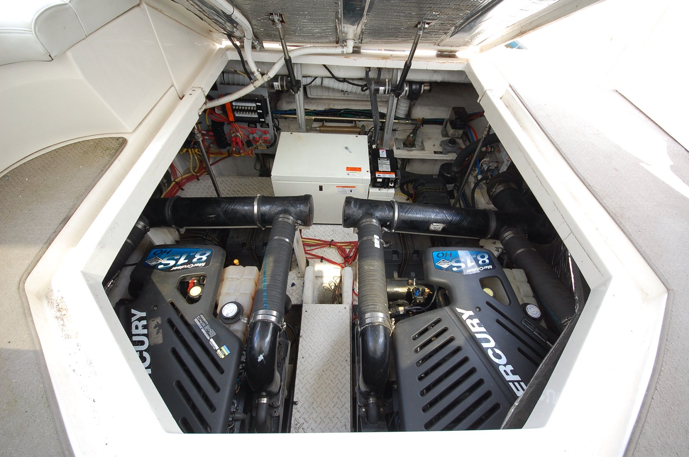 Engine room of a 2004 Cruisers Yachts 3970 with Mercury engines.