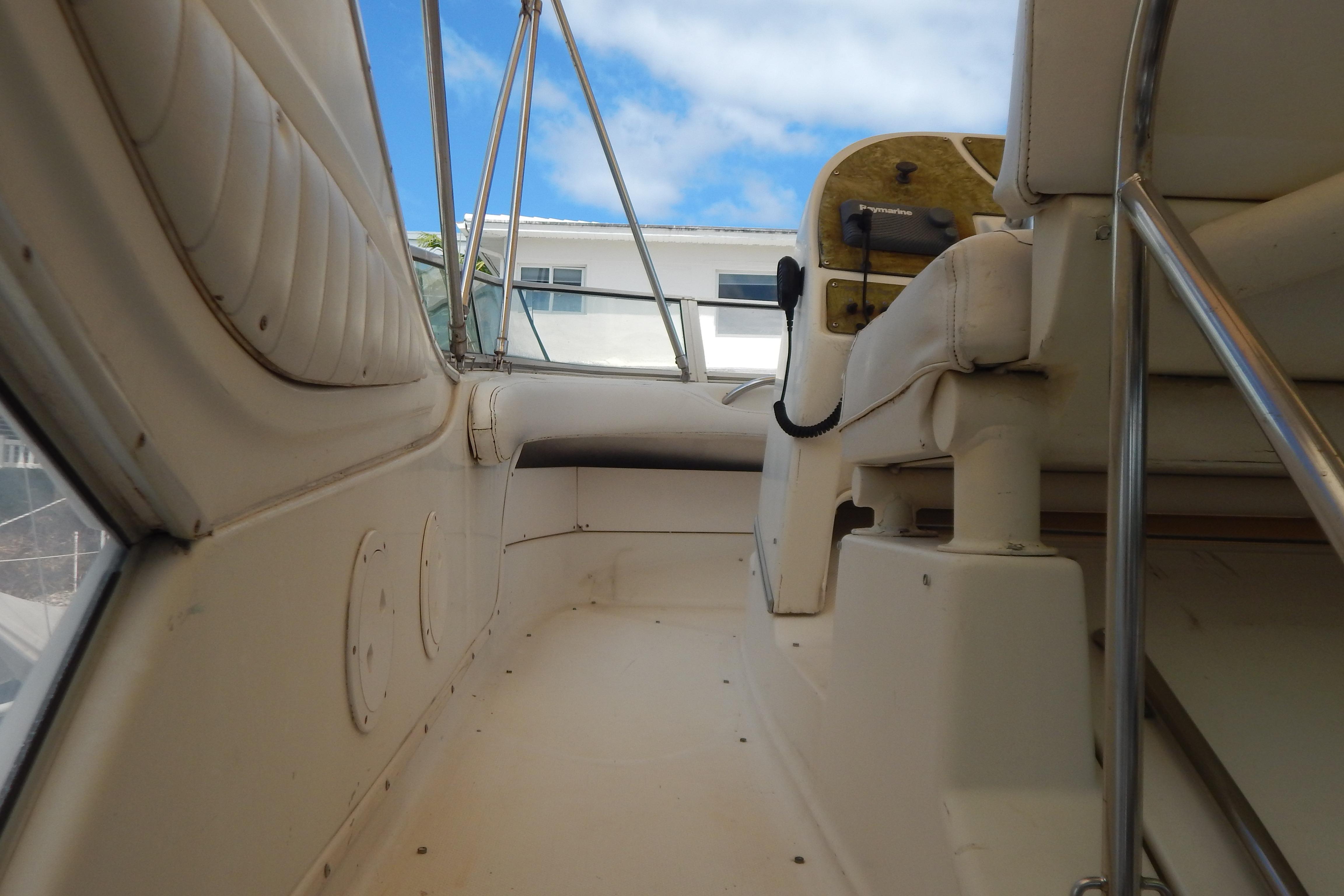 Interior view of a 1998 Magnum 4100 SCR boat, showcasing seating and controls.