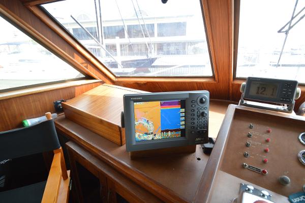 Interior view of a Hatteras 53 Yacht Fisherman helm with navigation system.