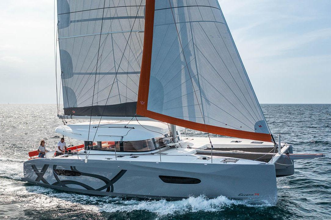Manufacturer Provided Image: 2026 Excess 14 catamaran sailing on open sea with modern design and vibrant sails.