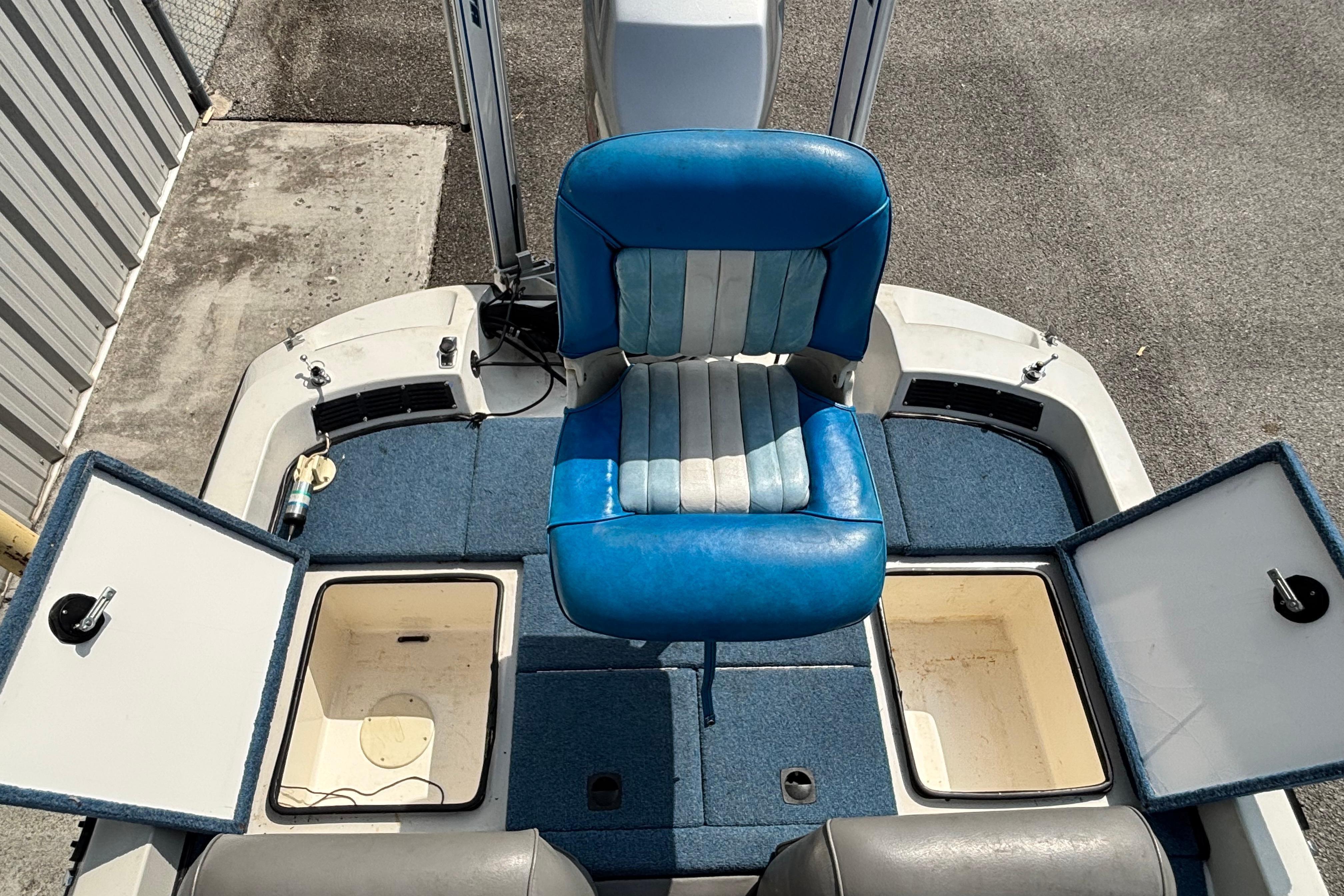 A 1991 Ranger 461VS with blue and white seating and two open storage compartments.