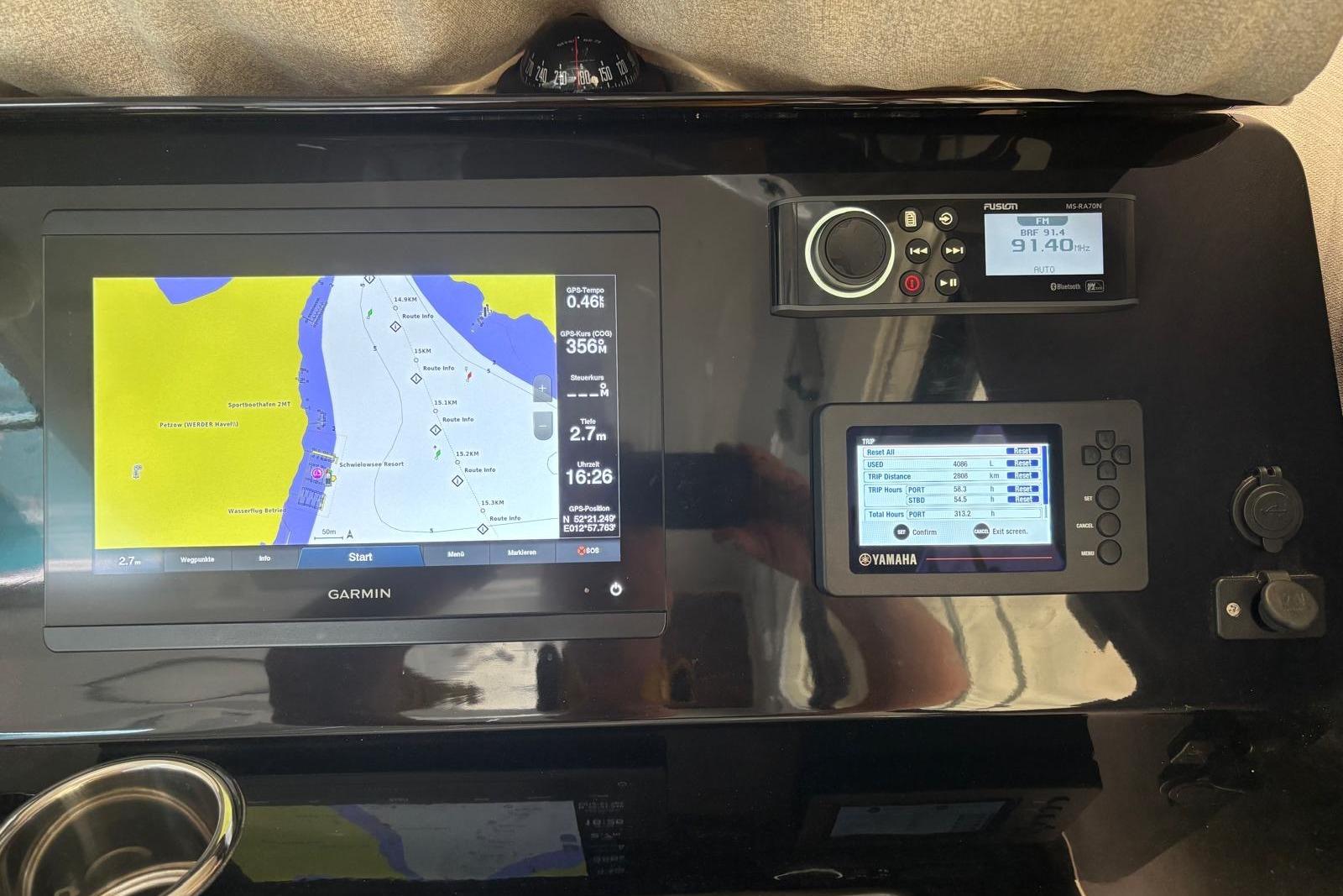 Dashboard of 2020 Jeanneau Merry Fisher 1095 with Garmin navigation system.
