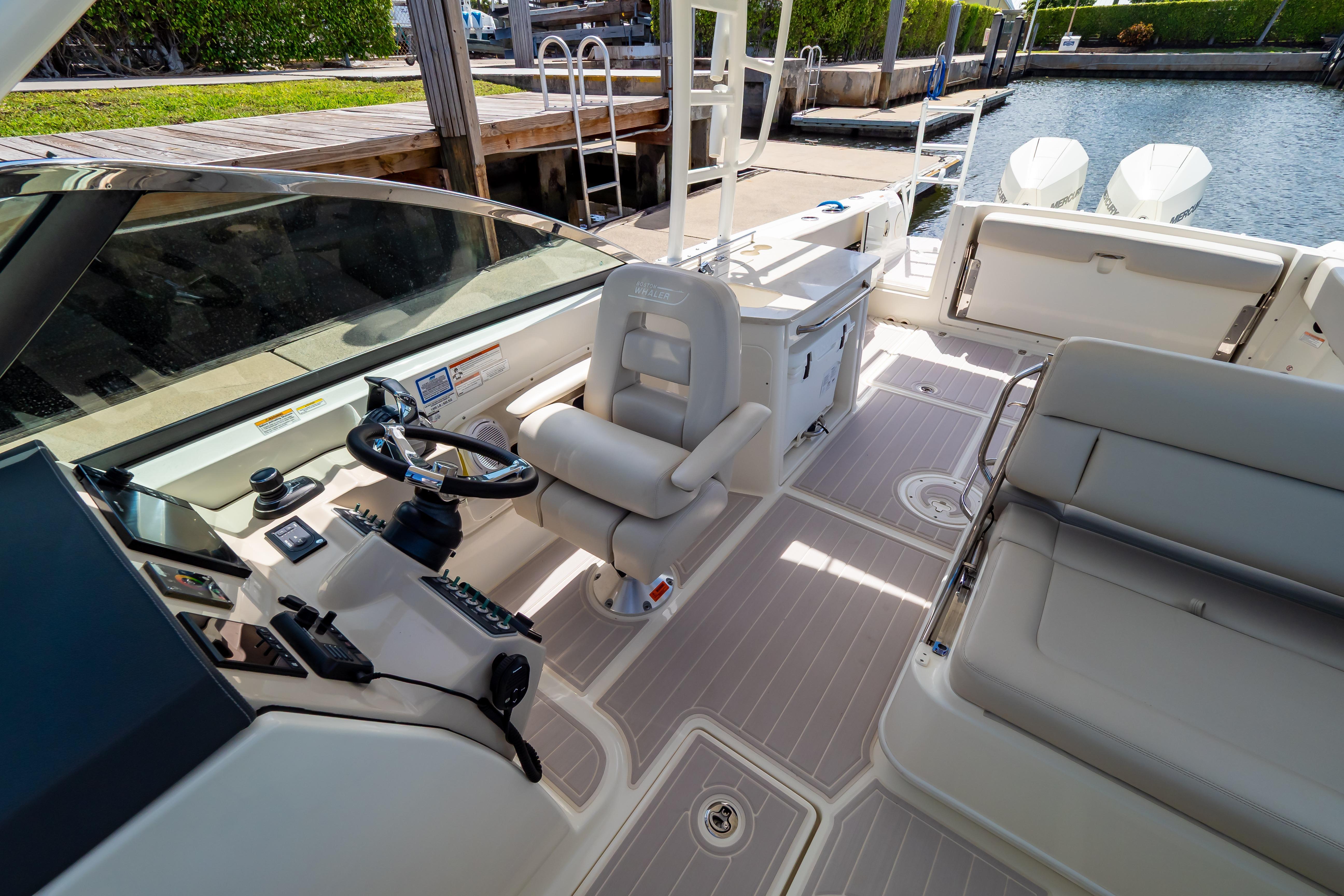 2019 Boston Whaler 270 Vantage boat interior with helm, seating, and controls.