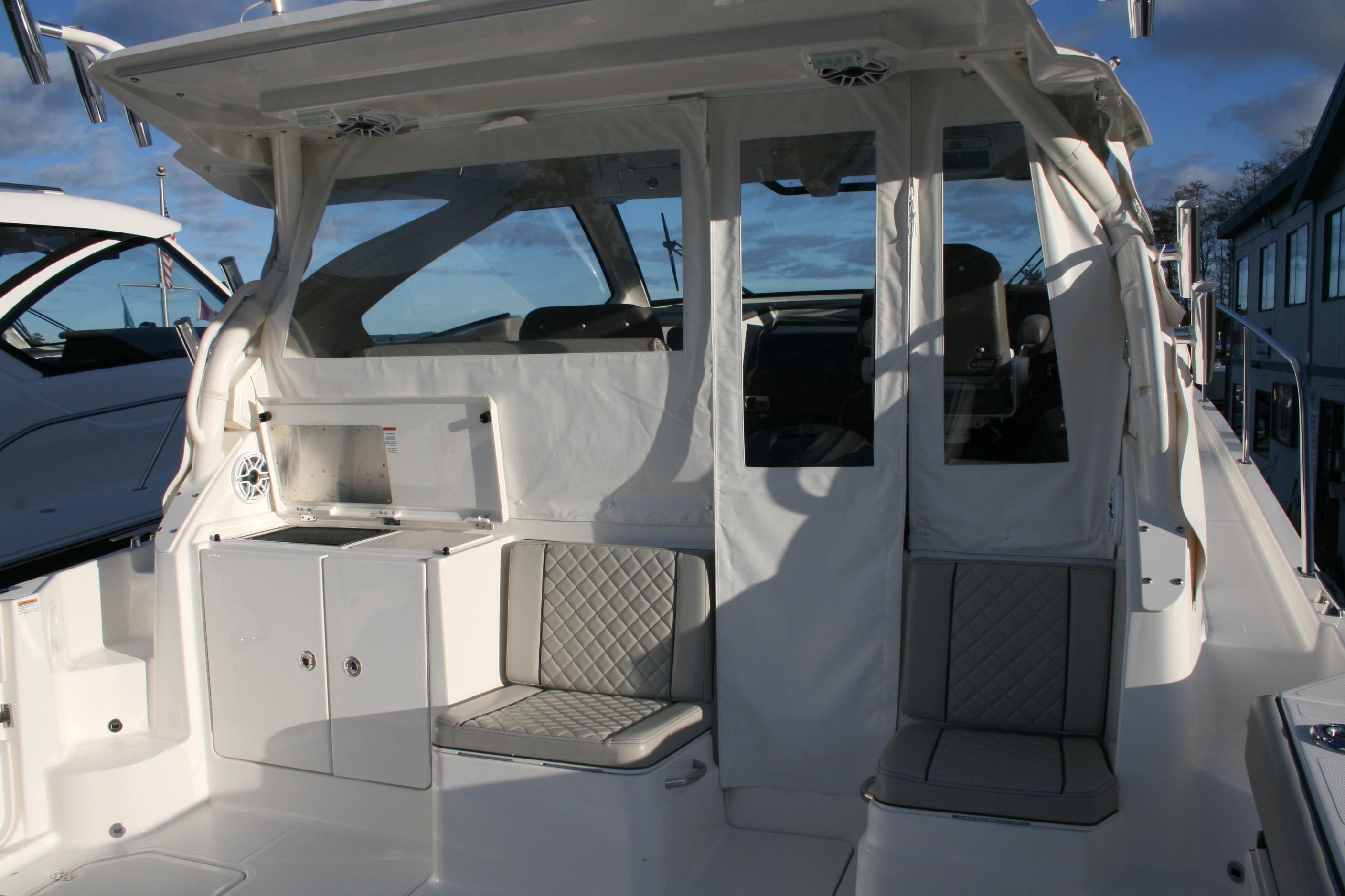 2025 Pursuit OS 405 Offshore boat interior with seating and storage compartments.
