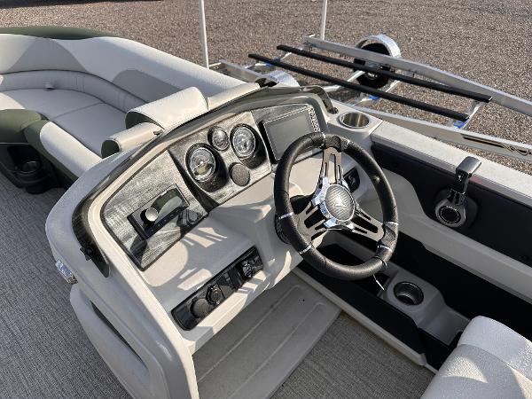 2025 Tahoe Pontoon LTZ Cruise Rear Bench dashboard with steering wheel and controls.