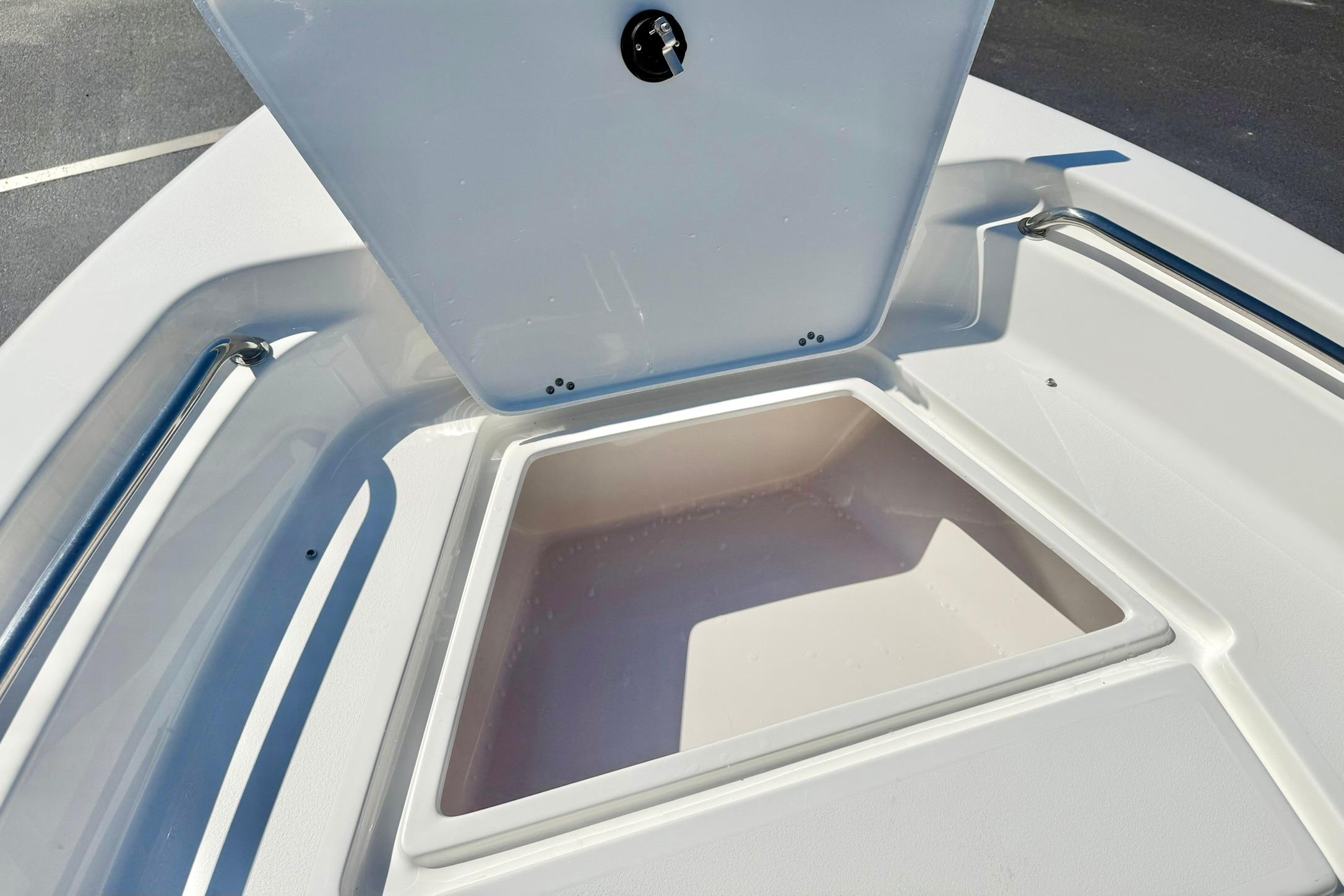 Open storage compartment on 2026 Key West 189 FS boat deck.