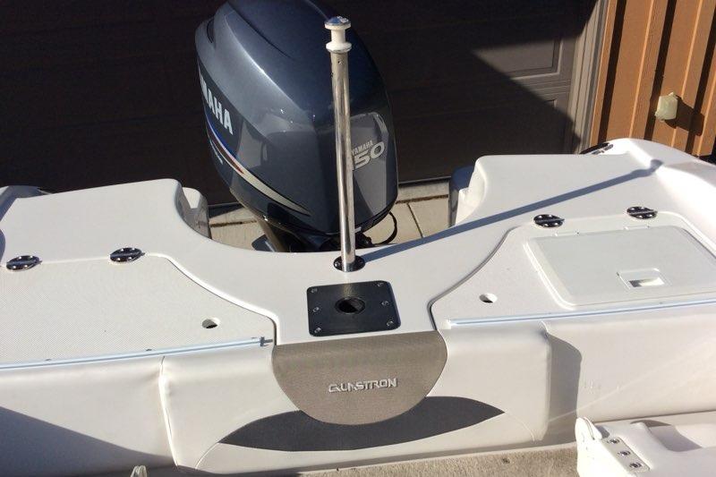 2012 Glastron GT180 boat with Yamaha 150 engine, rear view.