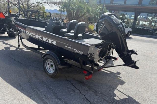 2026 Tracker Super Guide V-16 SC boat with Mercury outboard motor on trailer.