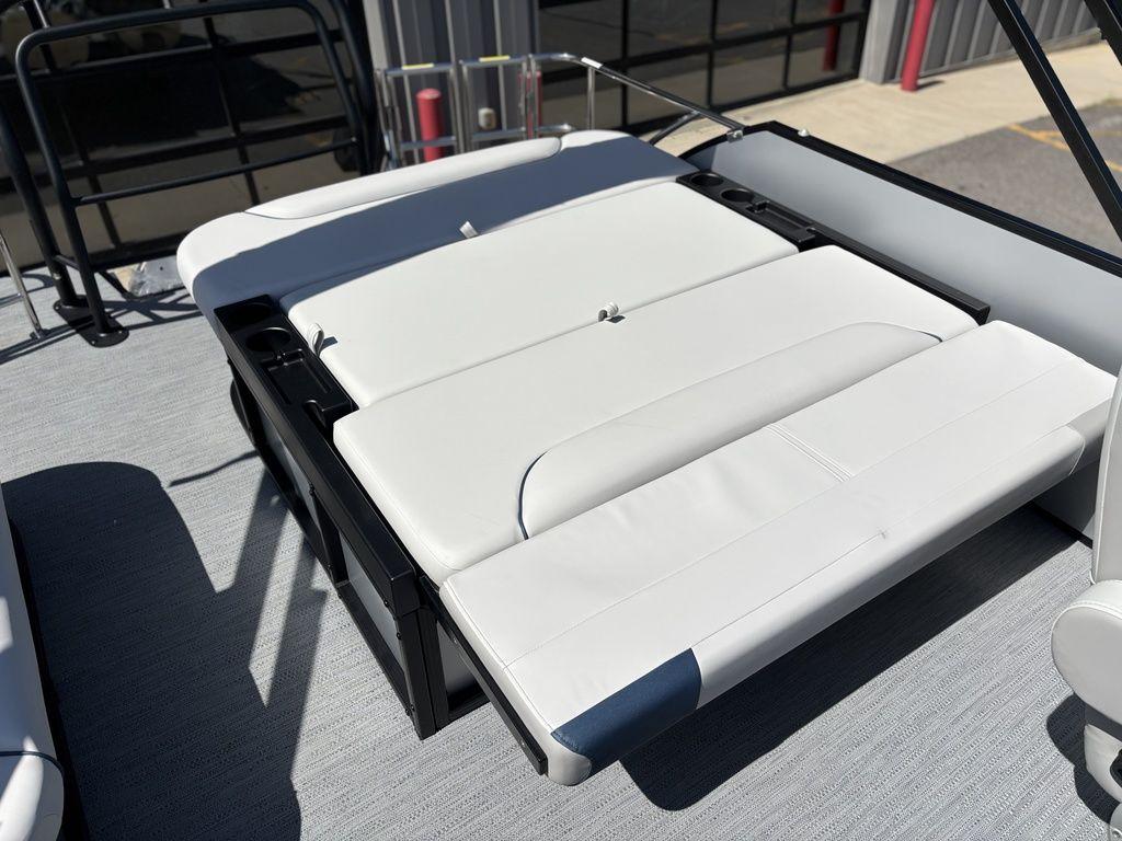 2026 Godfrey SWEETWATER 2286 SFL boat with white cushioned seating and cup holders.