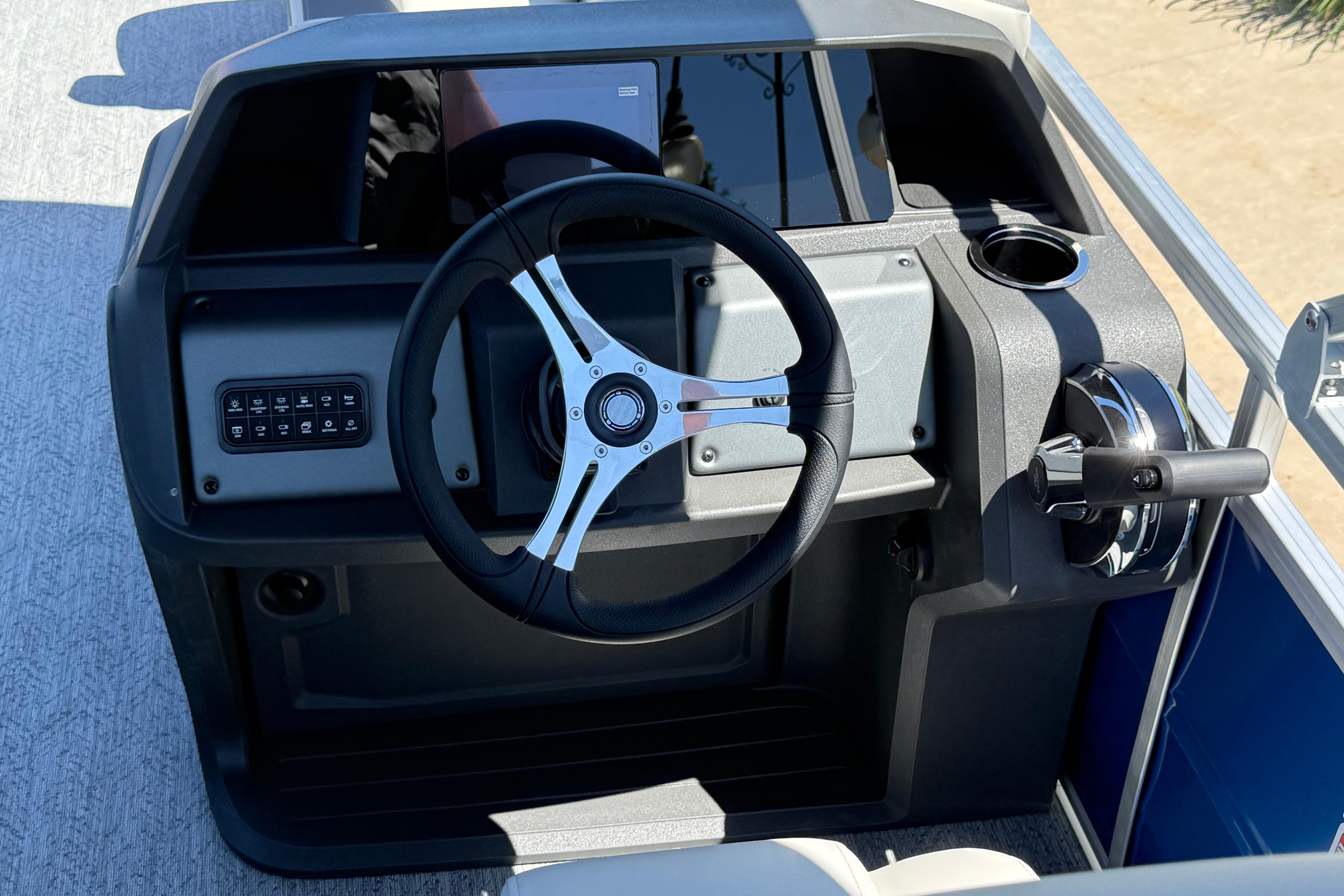 Steering console of 2026 Sun Tracker Fishin' Barge 20 DLX pontoon boat.