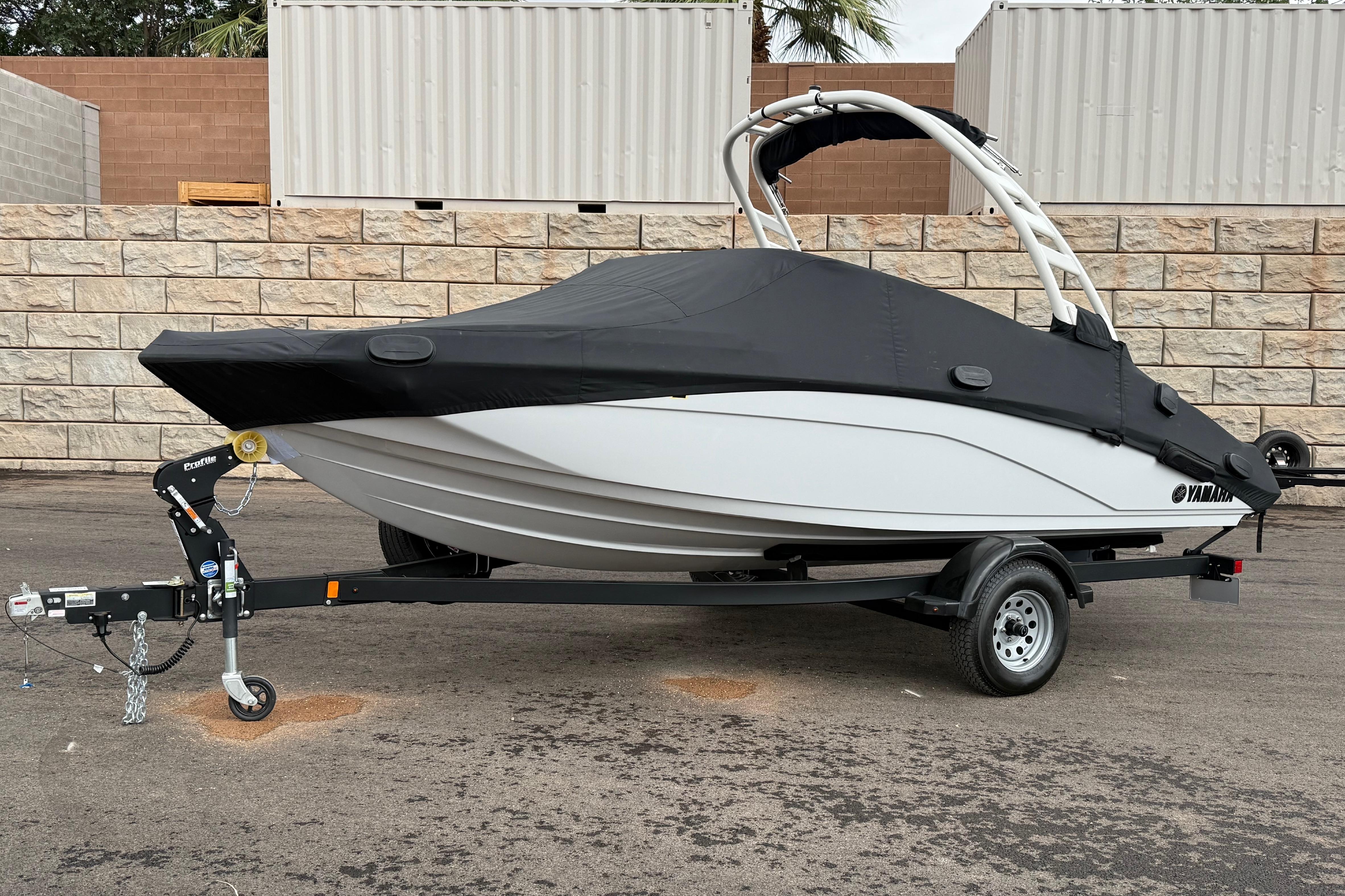 2025 Yamaha Boats 195S on trailer, covered, parked outdoors.