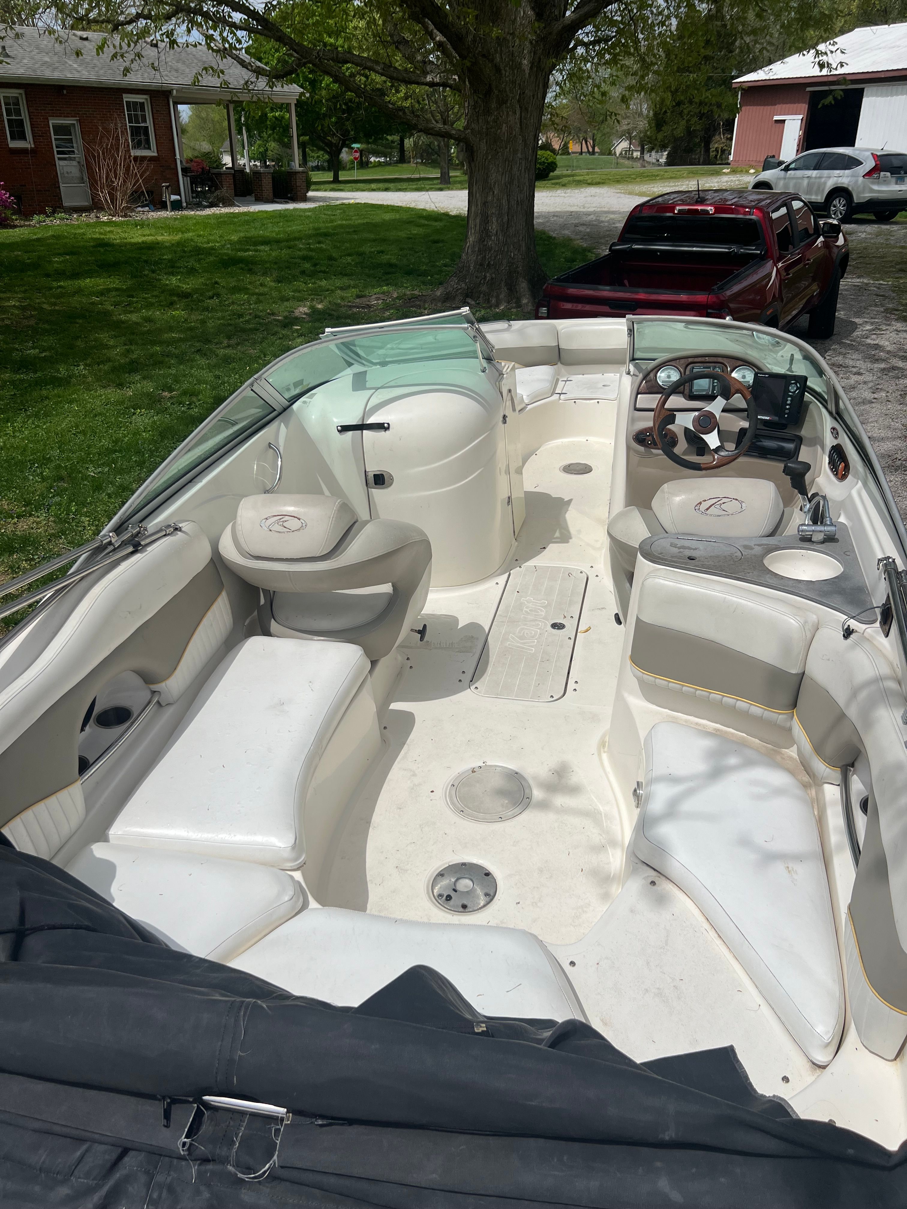 2007 Harris-Kayot S245 boat with interior view and steering wheel.