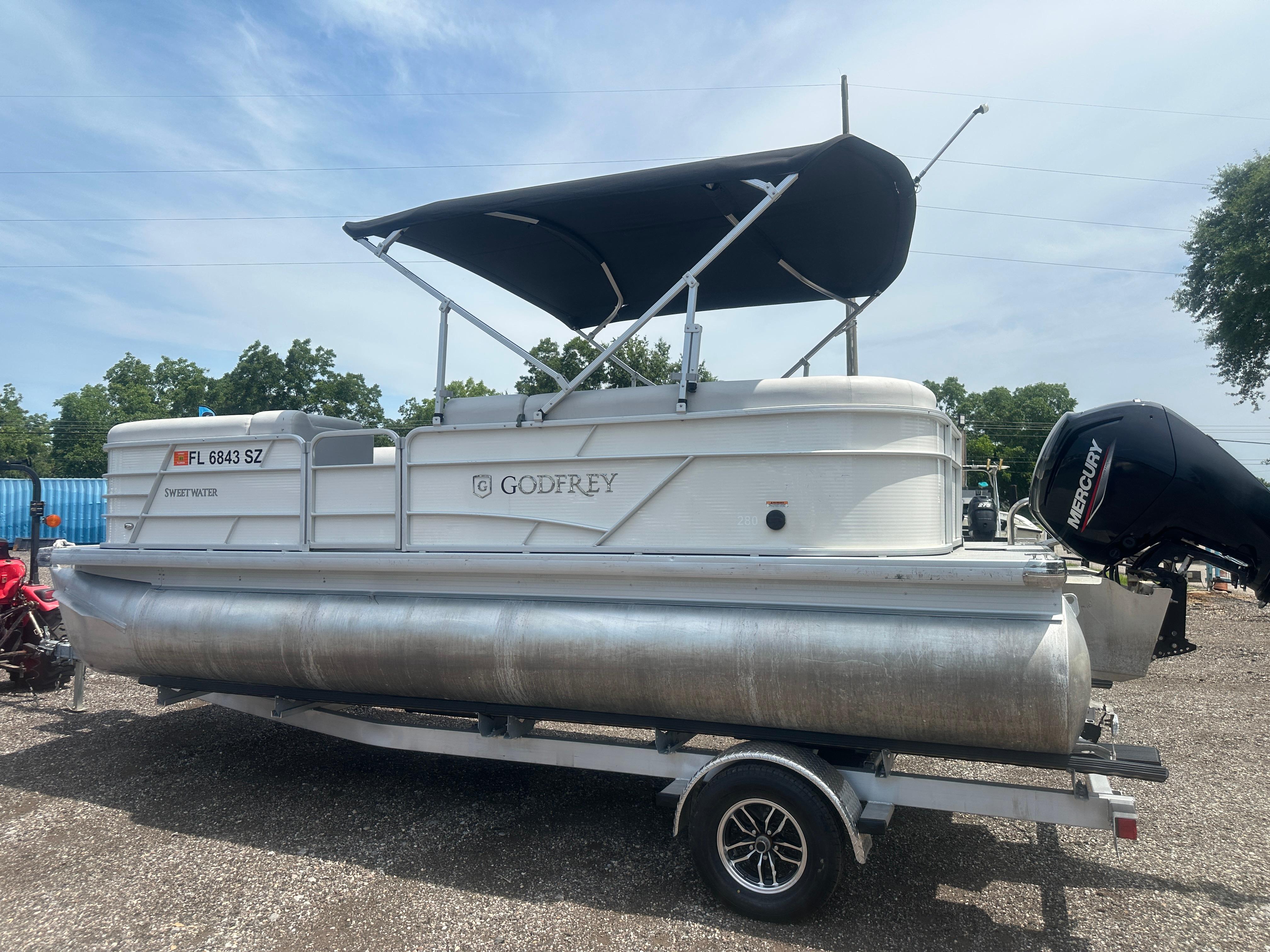 2021 Godfrey SWEETWATER 2186 SB pontoon boat with canopy on trailer.