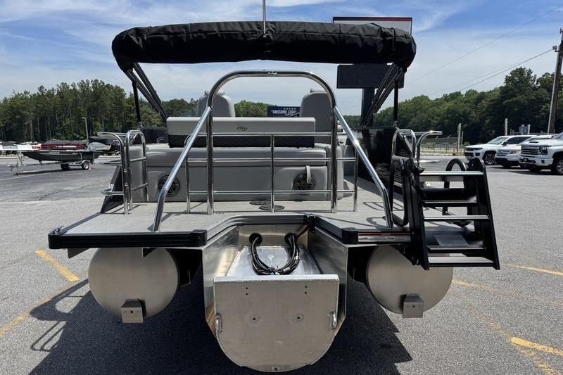 2026 Manitou Encore 25 SL SHP pontoon boat, rear view, parked outdoors.