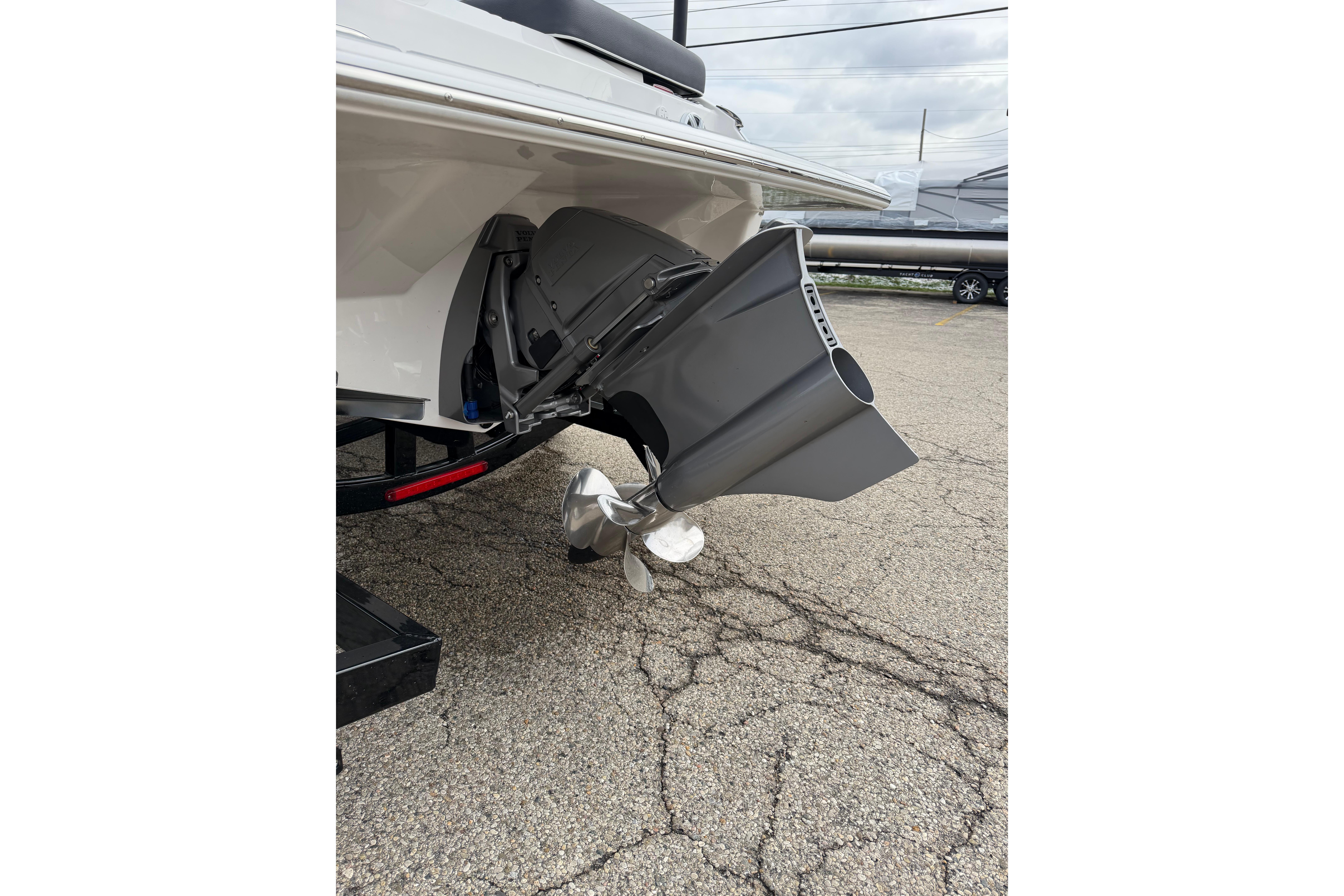 2026 Regal LS2 Surf boat propeller and stern view on pavement.