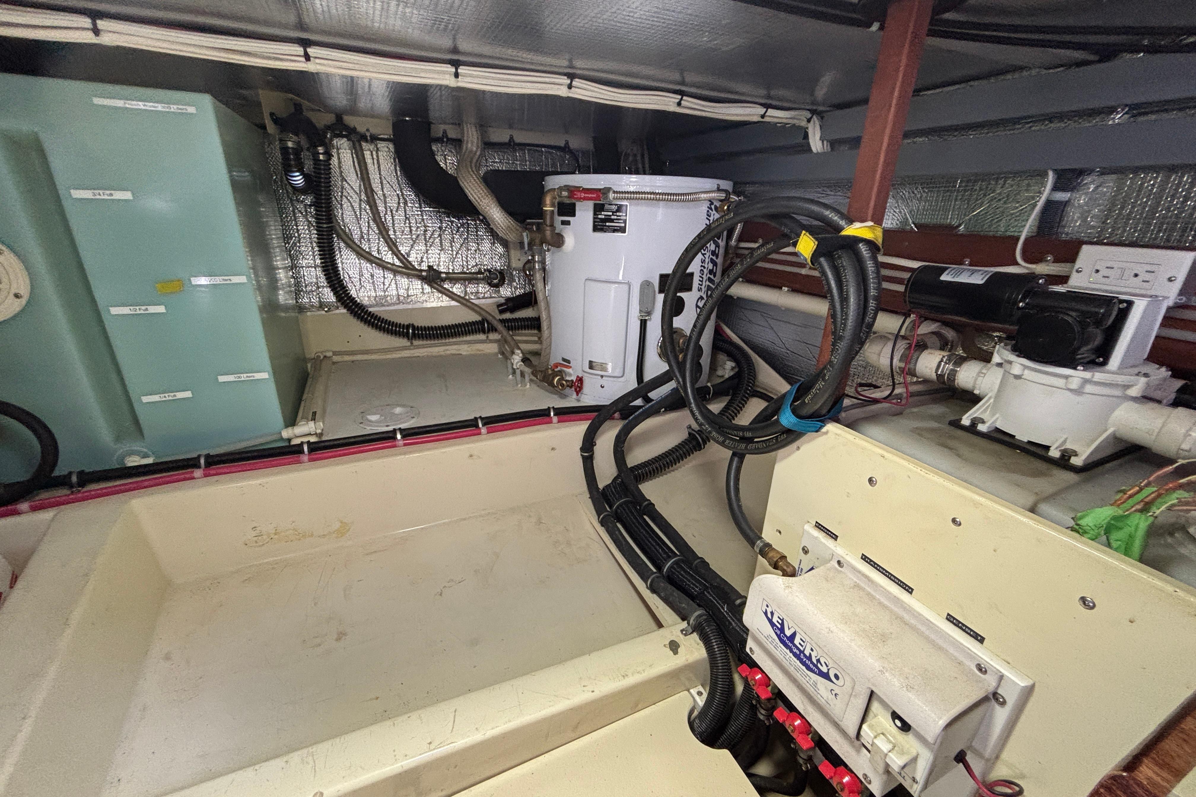 Engine room of a 2006 Camano 41 boat, featuring various mechanical components.