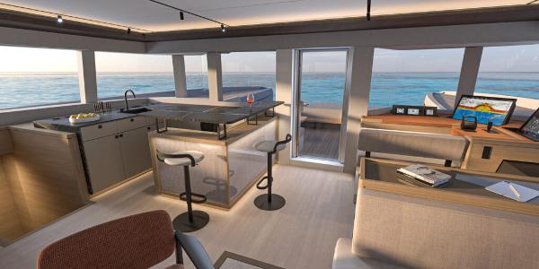 Luxurious interior of 2025 Lagoon 83 yacht with modern kitchen and ocean view.