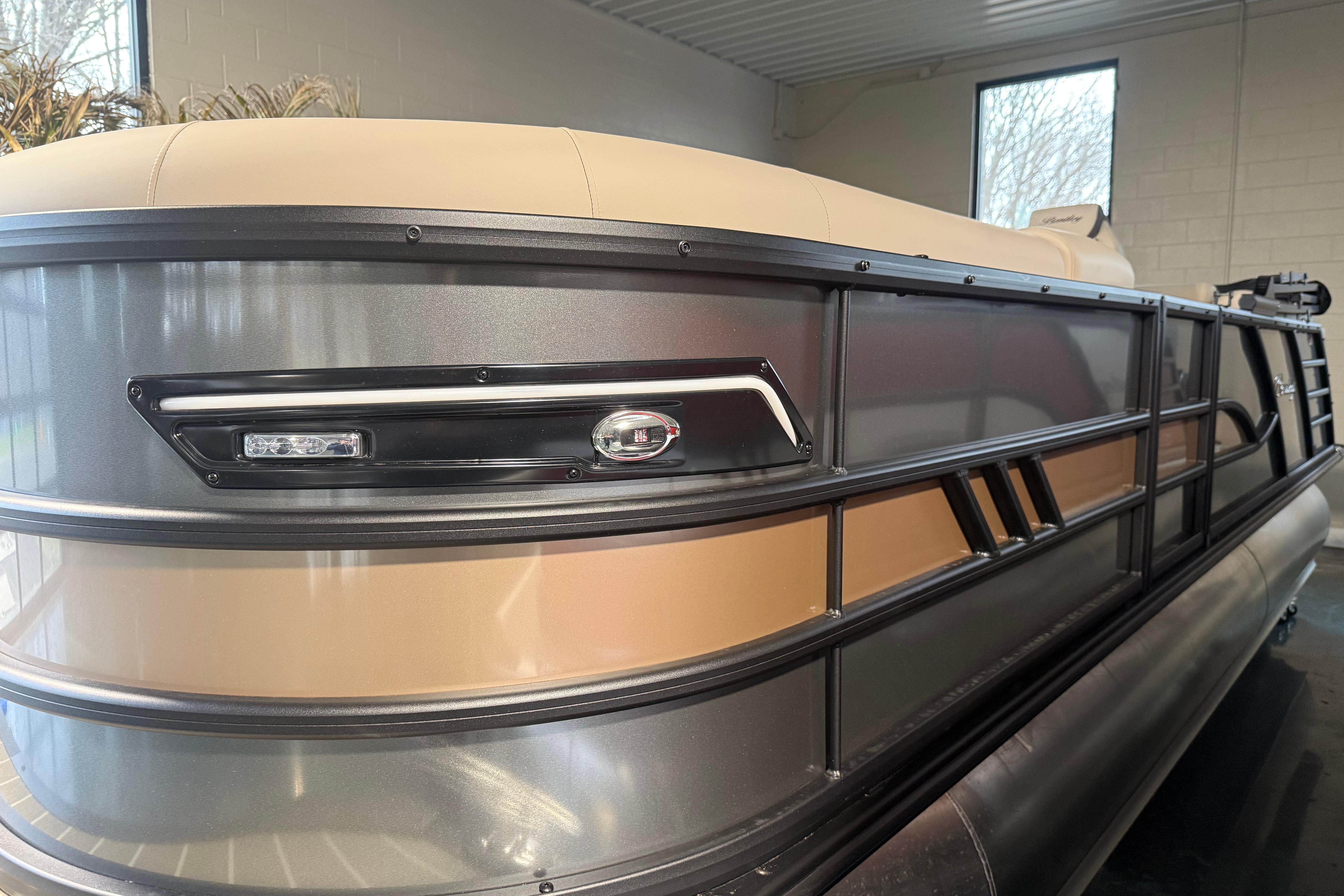 2026 Bentley Pontoons Elite 223 Admiral, sleek design in showroom setting.