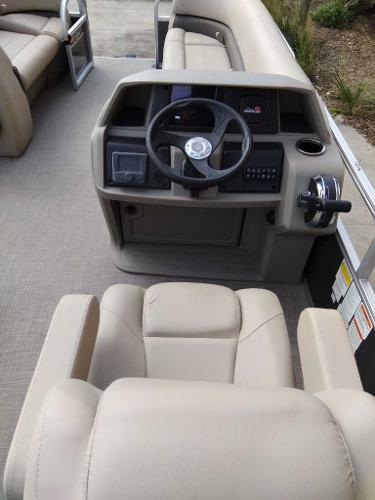 2025 Sun Tracker Party Barge 18 DLX interior with steering console and seating.