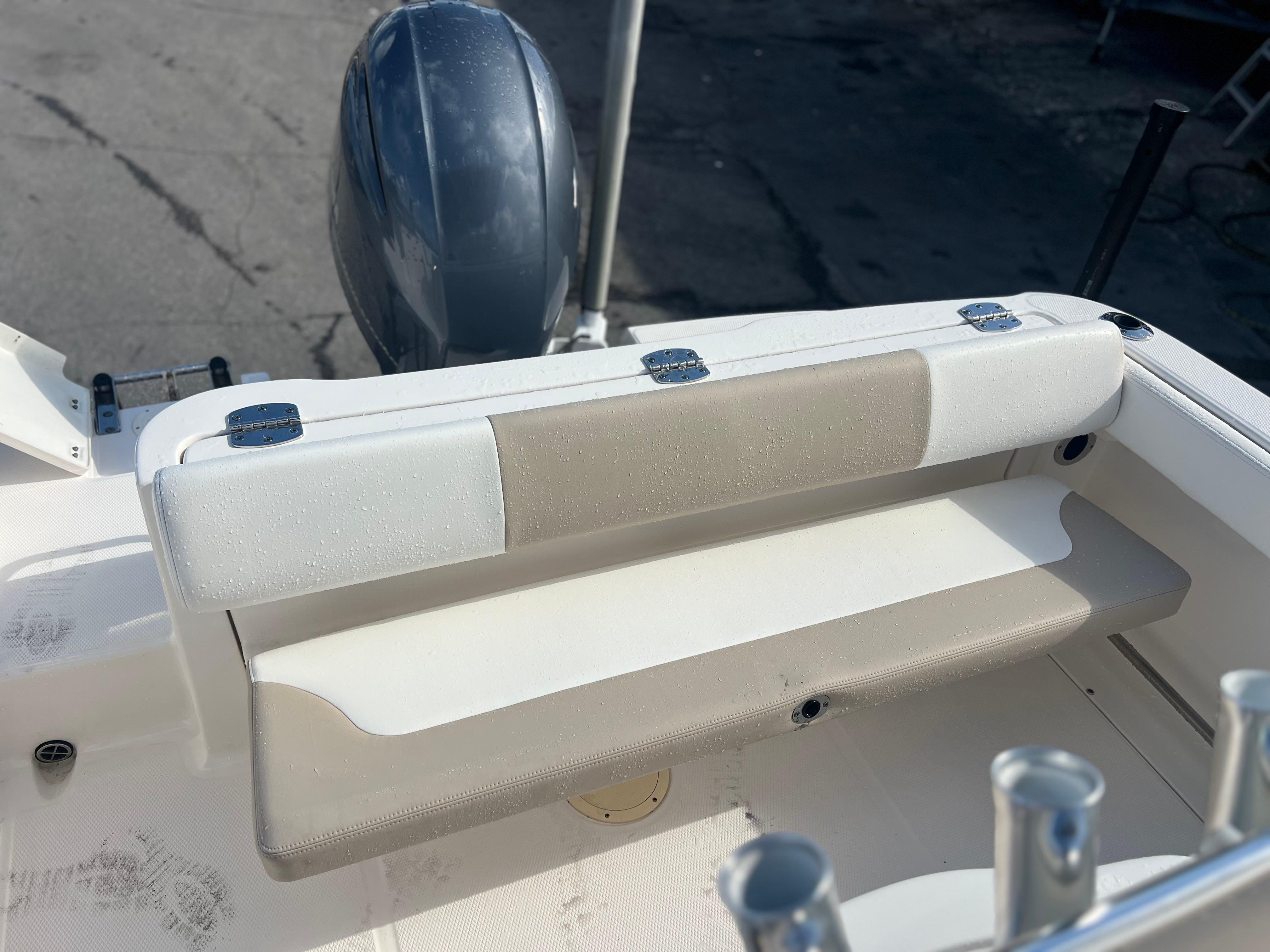 2022 Robalo R222 Center Console boat with cushioned seating and outboard motor.