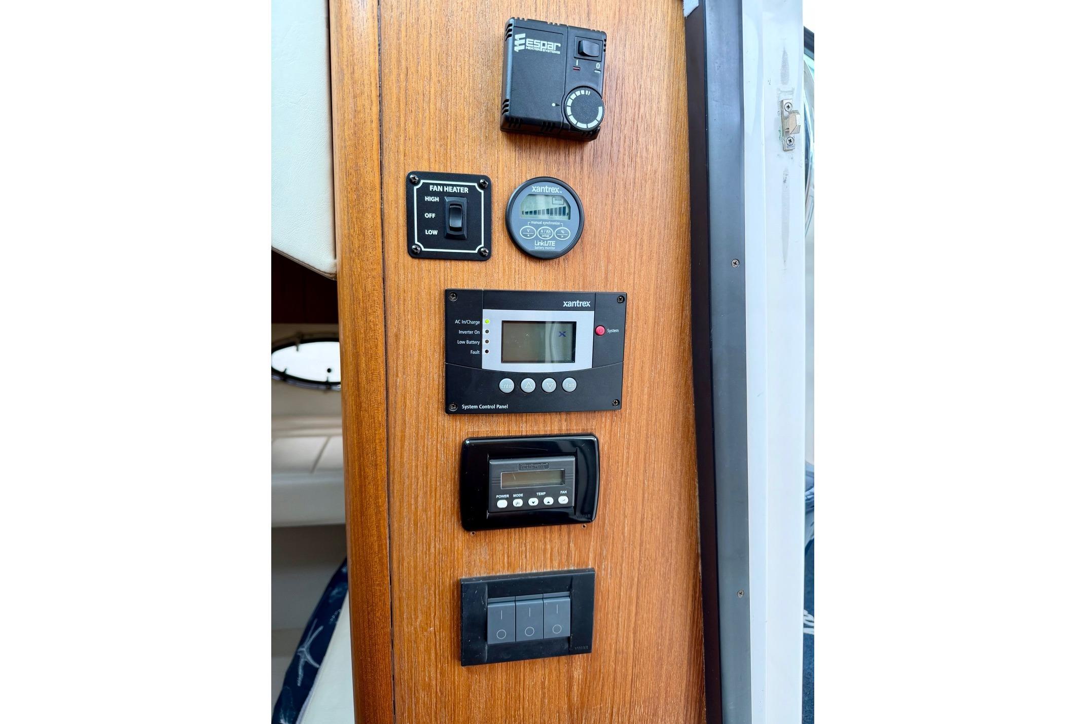 Control panel on 2003 Tiara Yachts 3500 Open, featuring various electronic displays and switches.