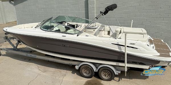 2008 Sea Ray 270 SLX boat on trailer, parked outdoors, side view.