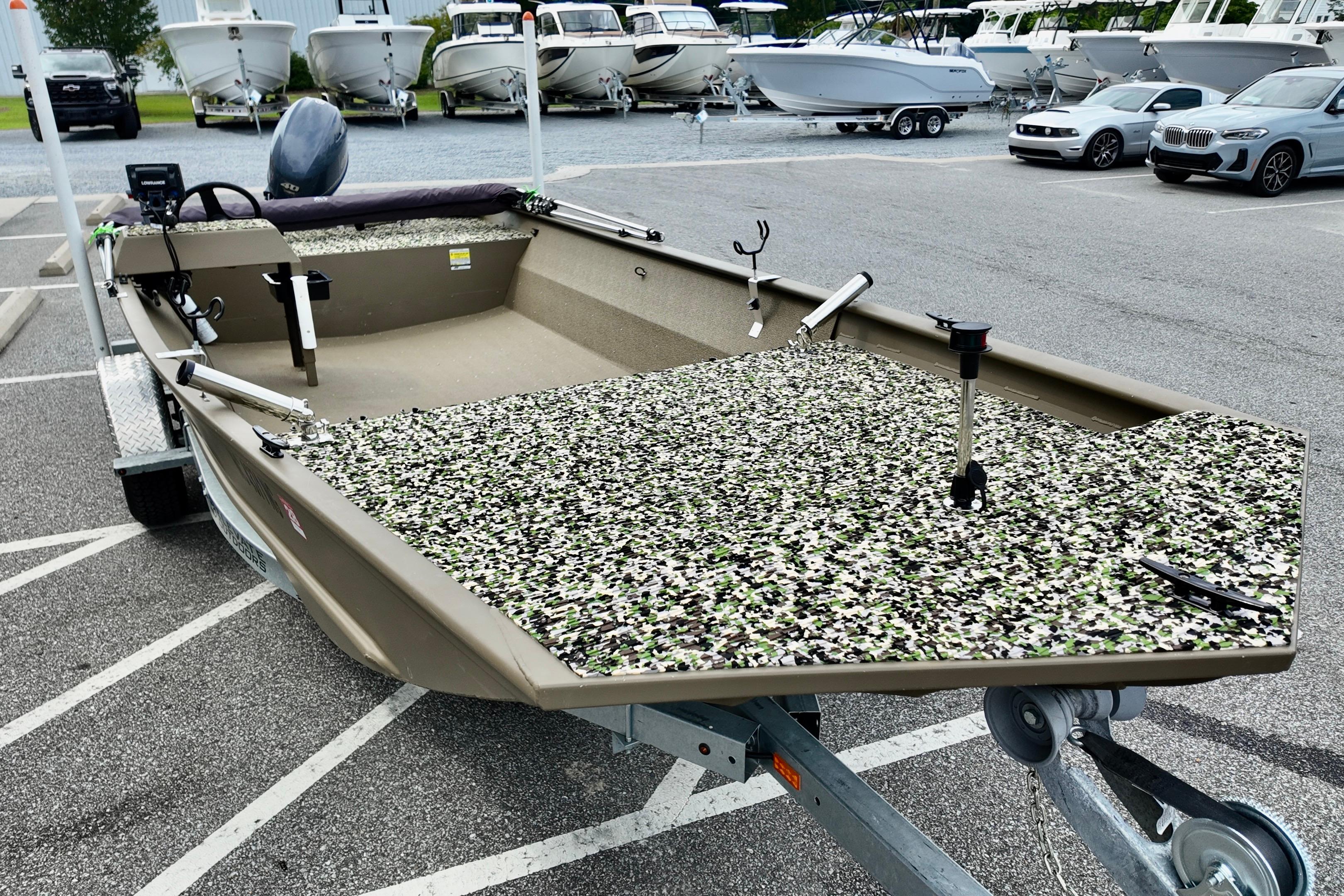 2025 G3 BOATS 1860 SC fishing boat on trailer in parking lot.