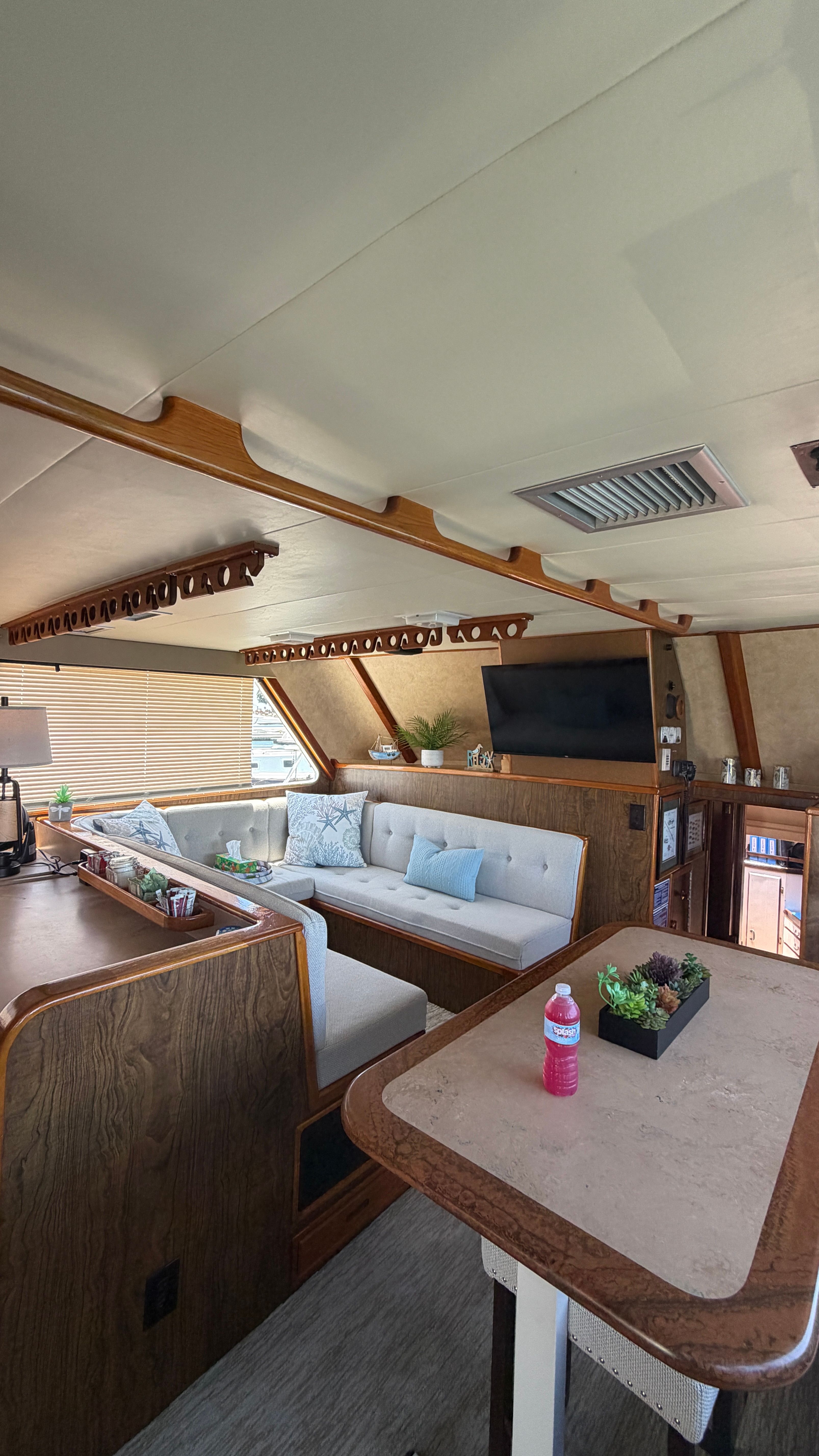 Interior of a 1966 Drake Yachtfisher with cozy seating area.